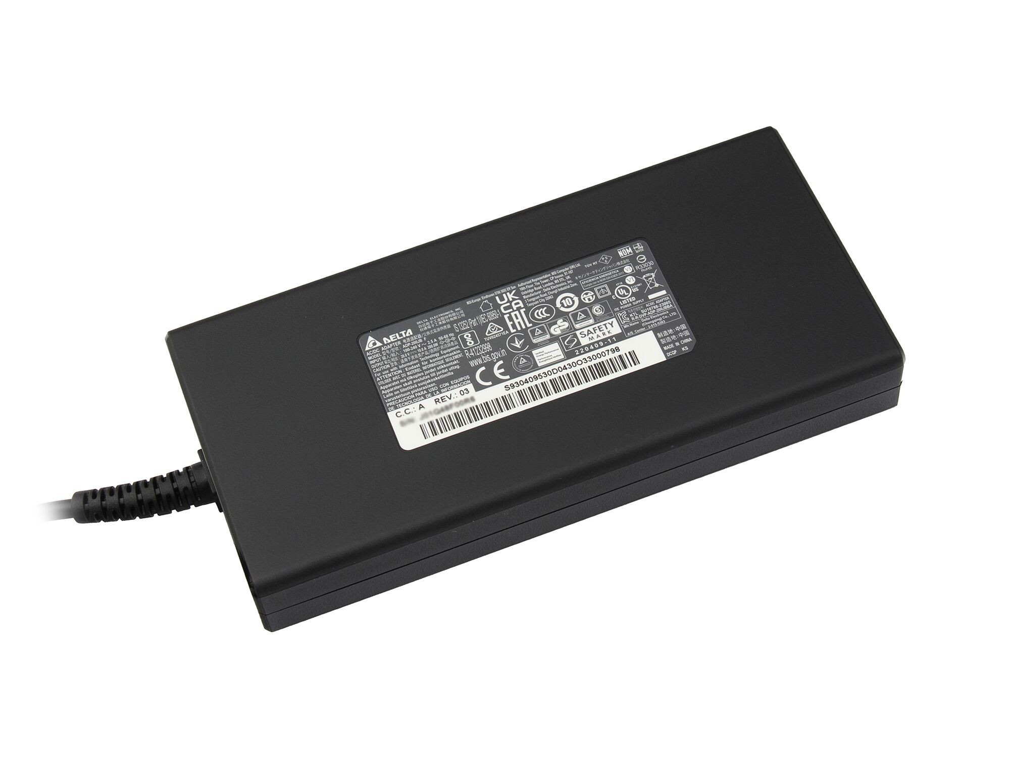 Schwarzes Delta AC-Adapter mit Etiketten. Es ist rechteckig mit einem Kabel links angebracht.