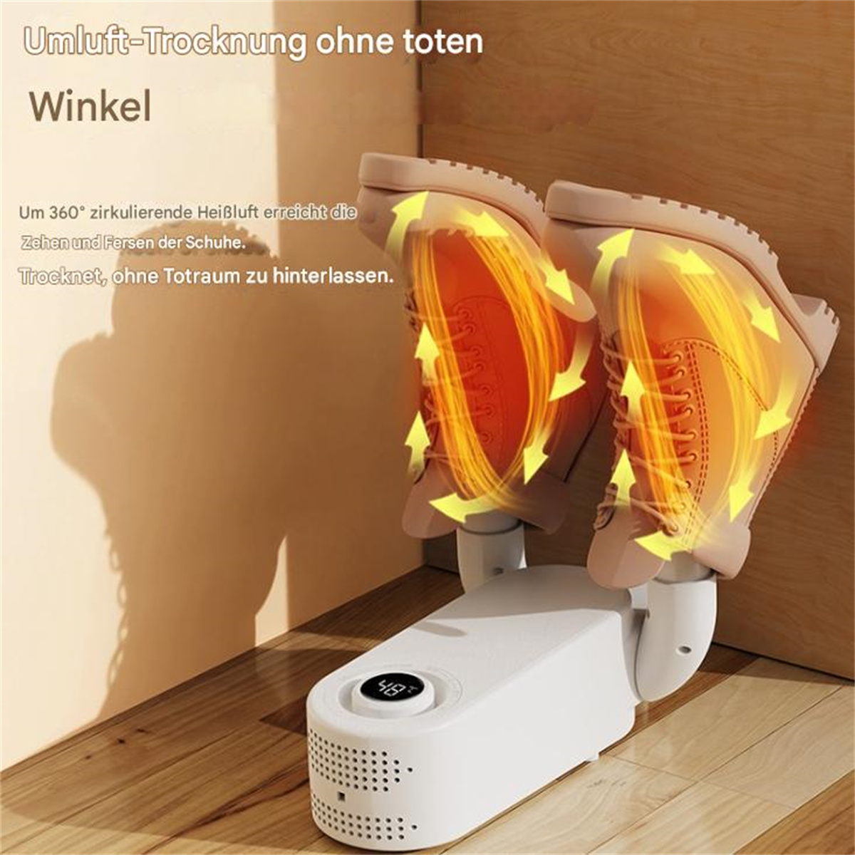 Schuhtrockner mit zwei Stiefeln, Pfeile zeigen den Wärmefluss, auf weißer Fläche.