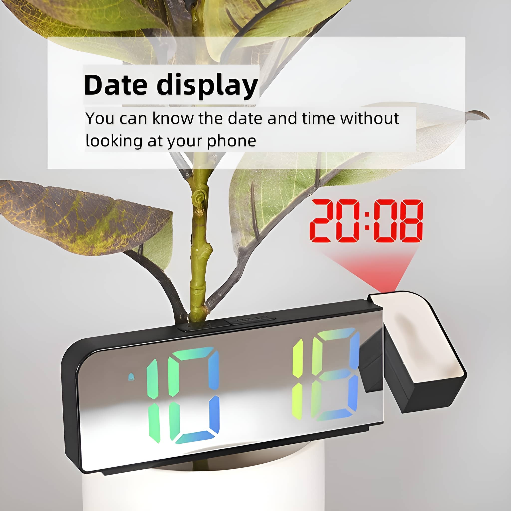 Digitaler Wecker mit Datumsanzeige und Pflanze. Die Uhrzeit ist 20:08.