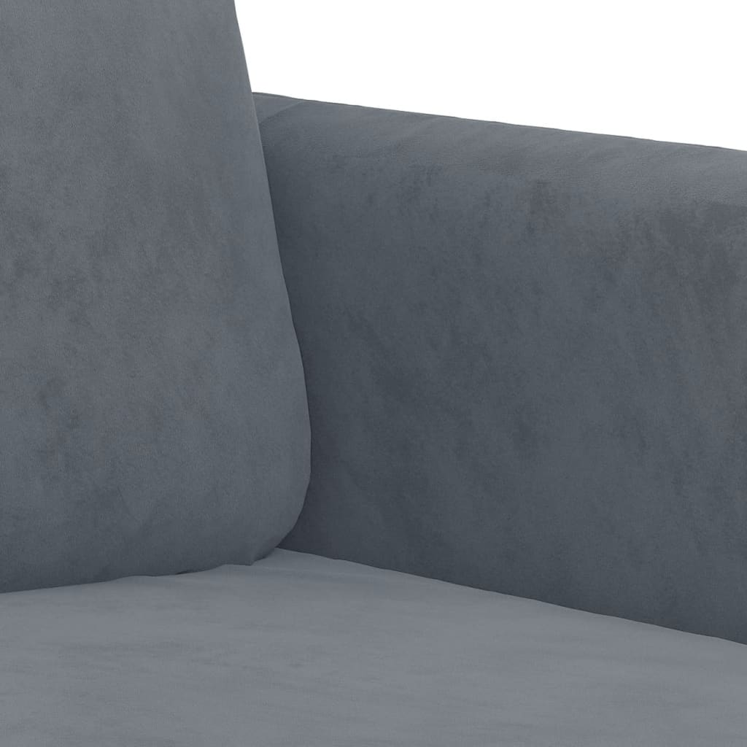 Nahaufnahme eines grauen Sofas. Die Ecke hat eine gebogene Armlehne und ein Kissen.