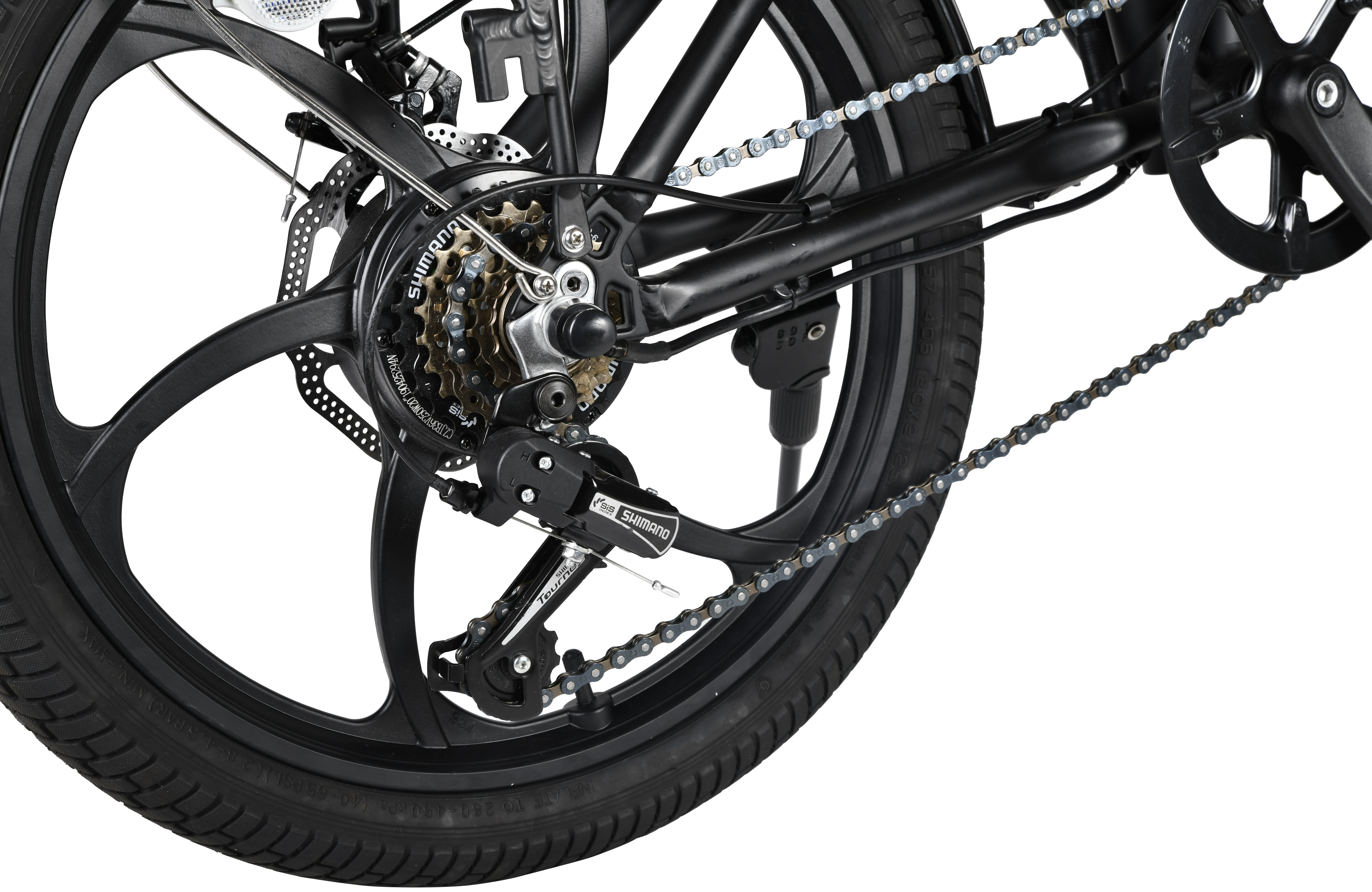 Close-up of a black bicycle wheel with a Shimano derailleur and chain.