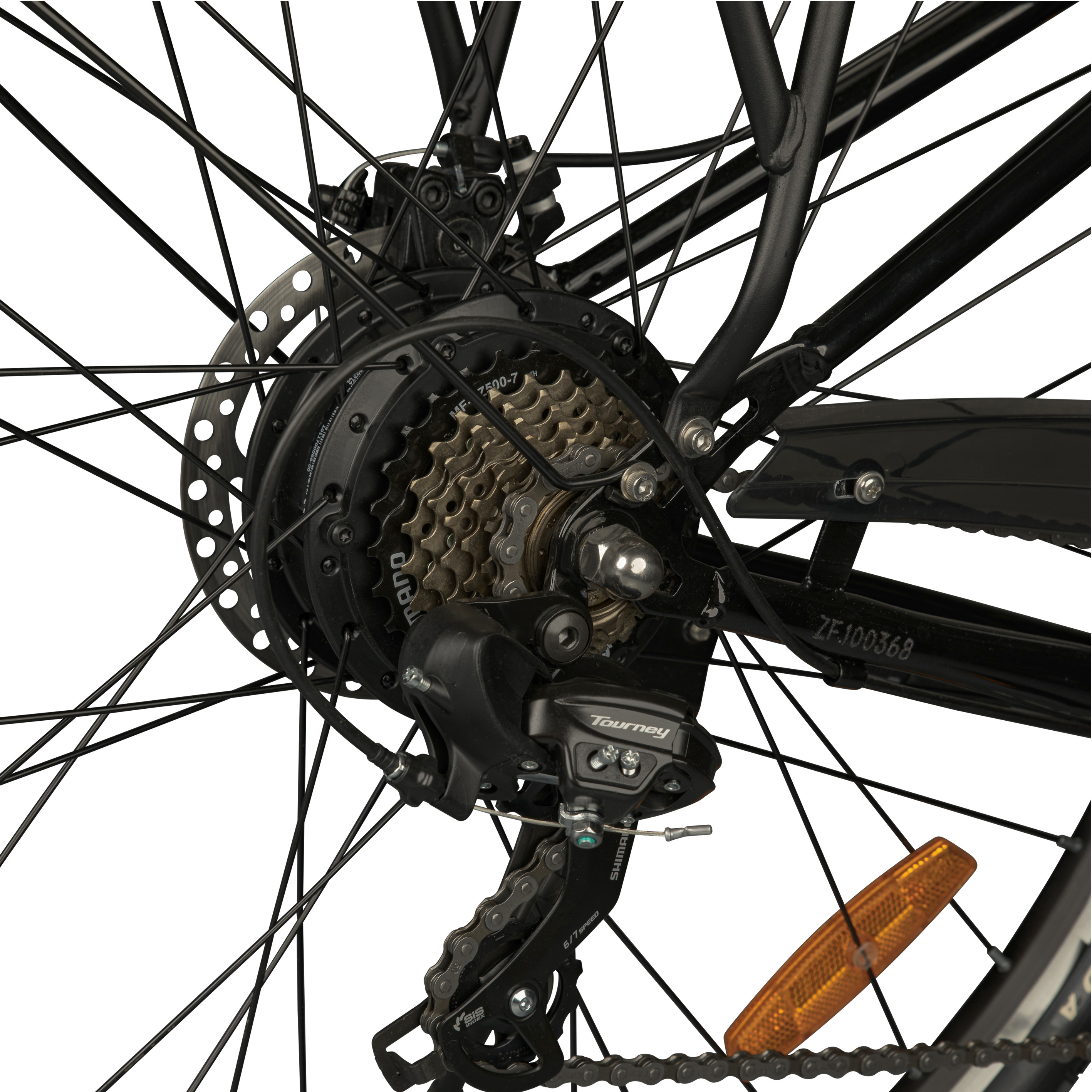 Close-up of a bicycle rear wheel with gears, disc brake, and a Tourney derailleur.