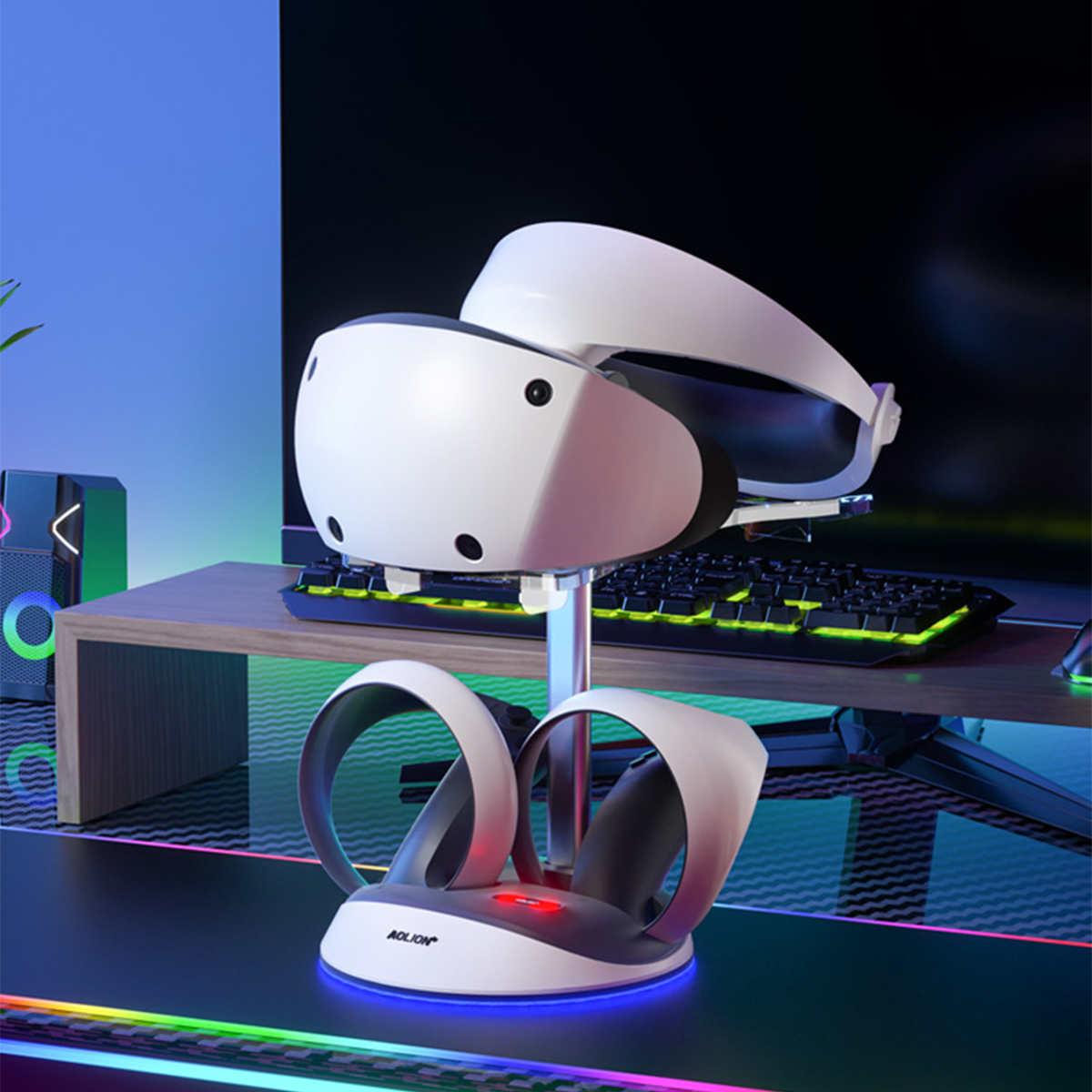 Ein VR-Headset mit Controllern auf einem Schreibtisch. Auf dem Schreibtisch befinden sich weitere Computerkomponenten.