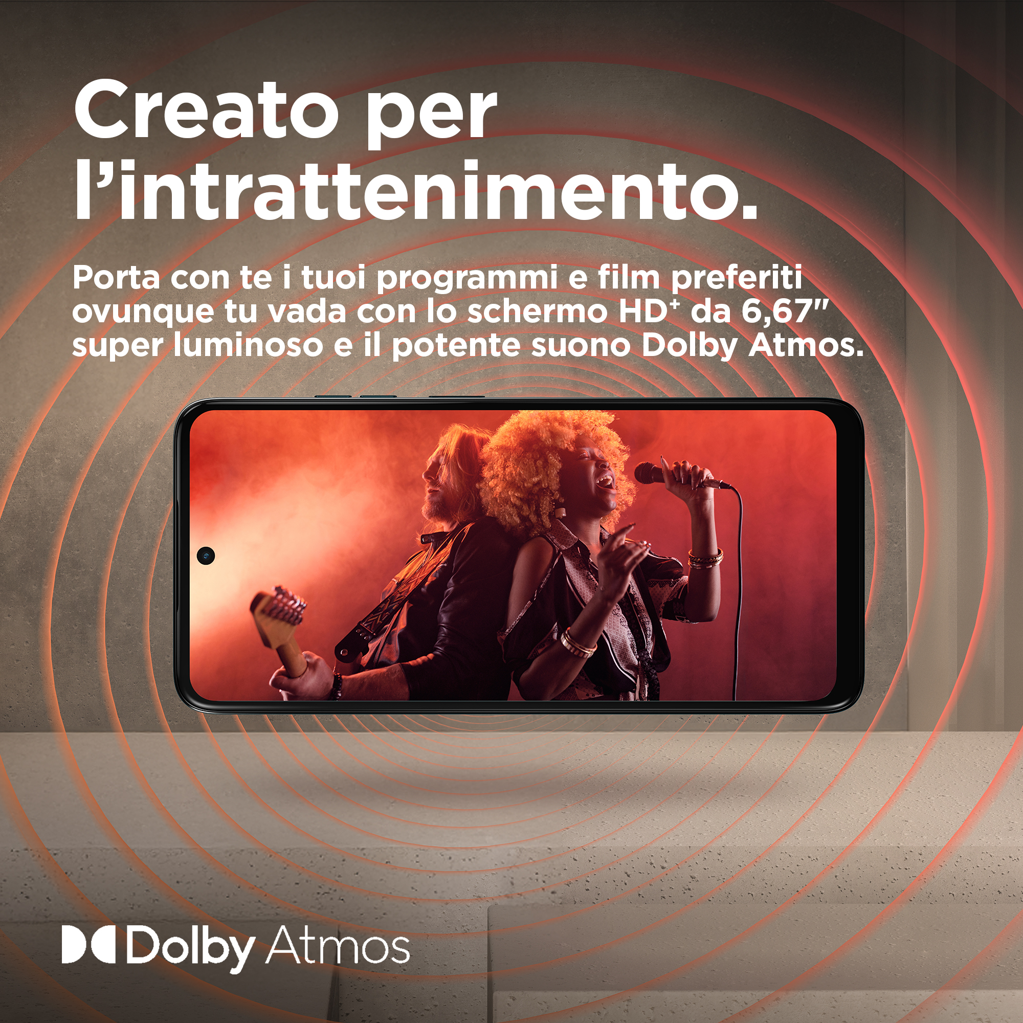 Ekran telefonu z dwoma piosenkarzami z gitarą, z logo Dolby Atmos.