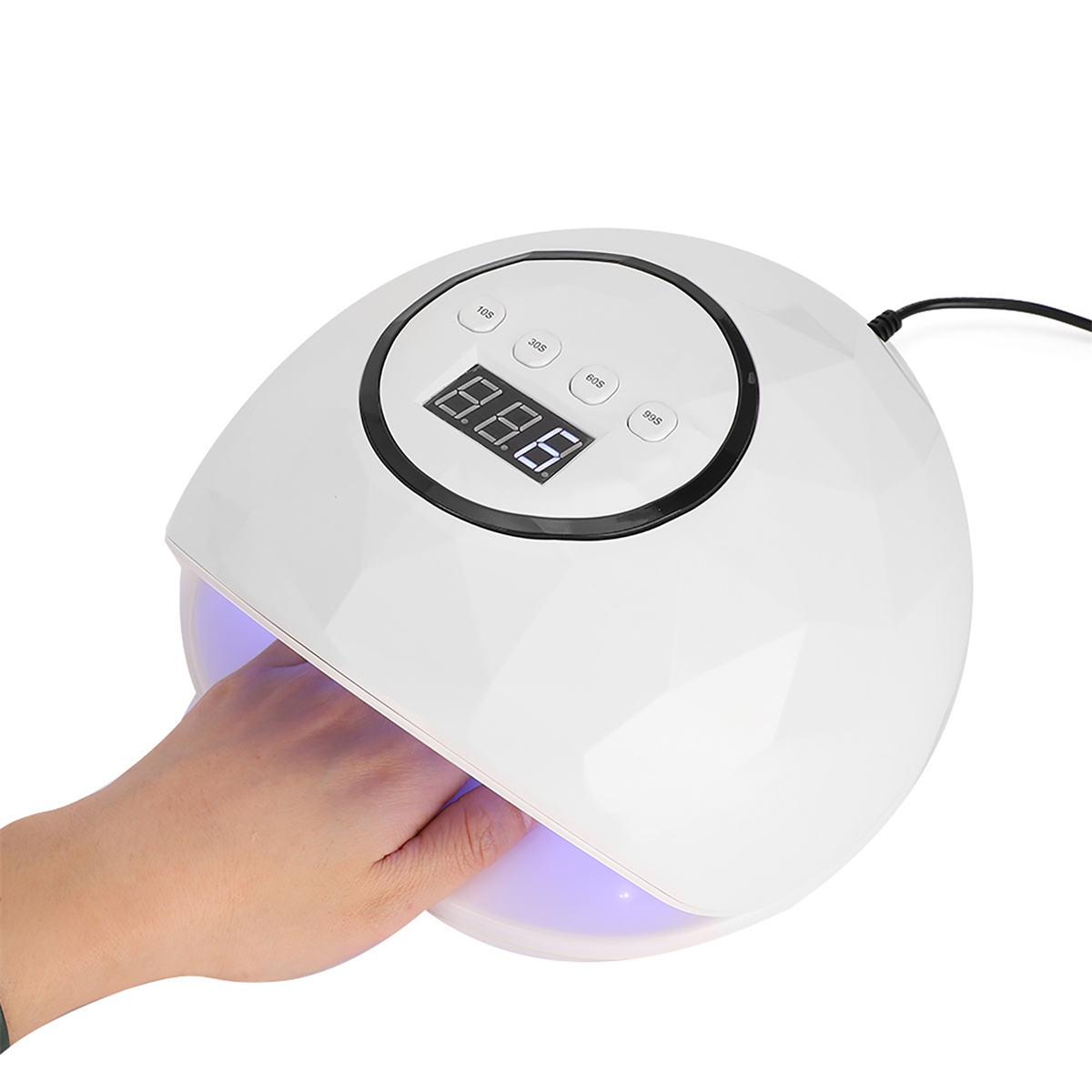 Ein weißer Nagelkunsttrockner mit einer Hand darin, die einen digitalen Timer anzeigt.