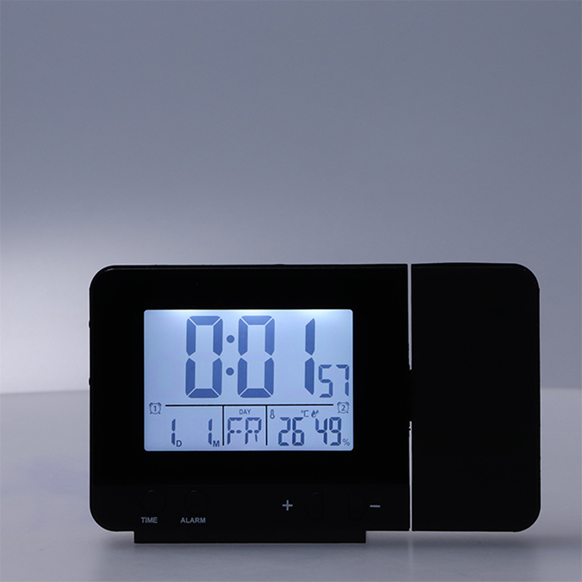 Eine schwarze Digitaluhr, die Zeit, Datum, Temperatur und Luftfeuchtigkeit anzeigt.