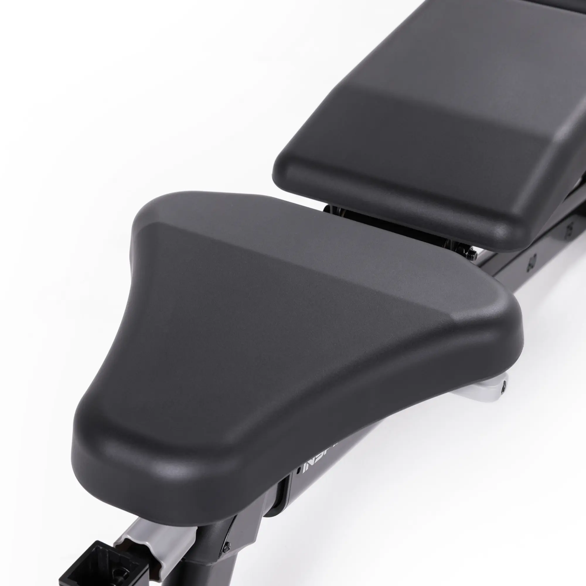 Close up of the black seat of the weight bench.