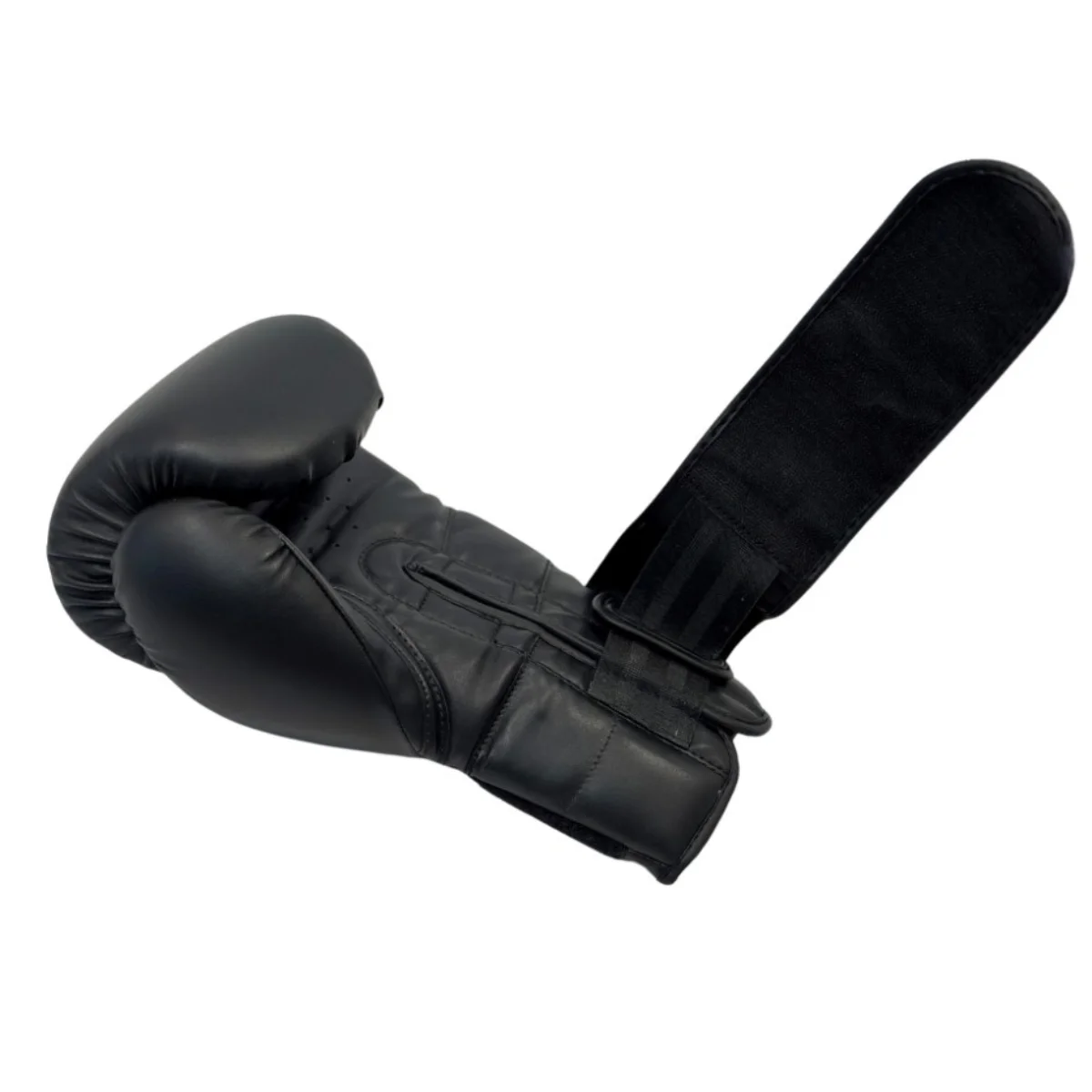 A single black boxing glove with the wrist strap extended, isolated on white.