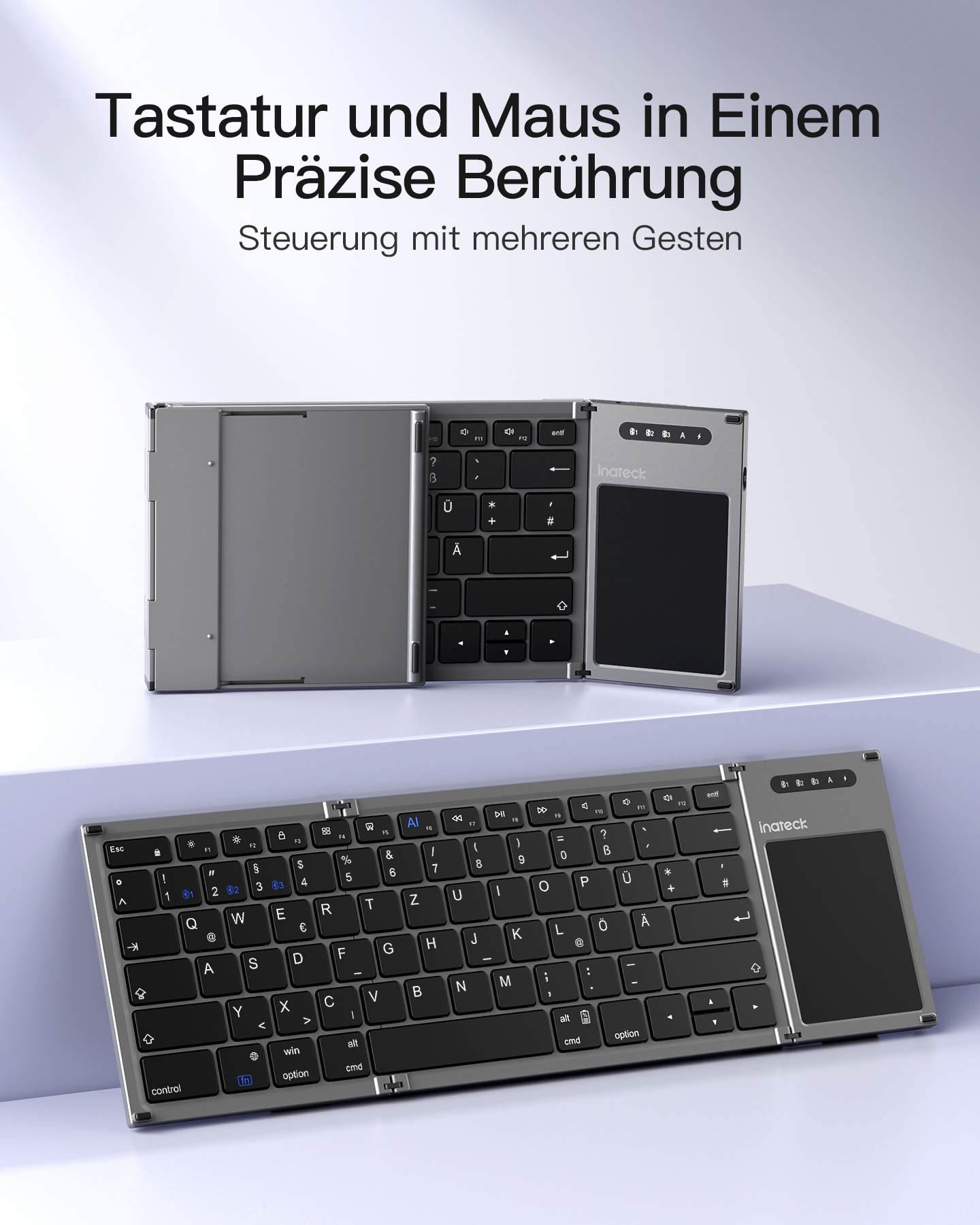 Tastiera argentata con touchpad integrato, design diviso e layout dei tasti.