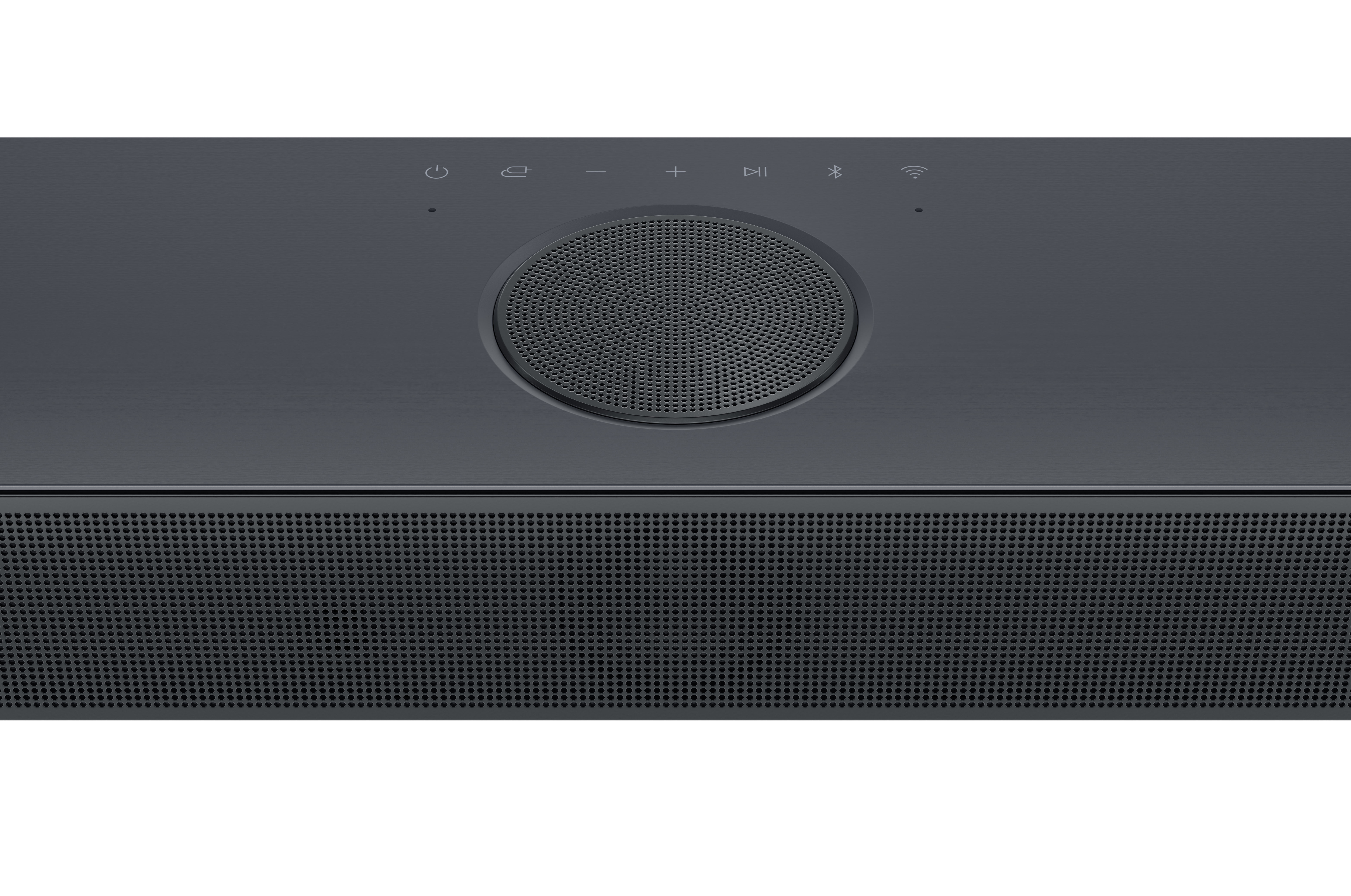Nahaufnahme des Bedienfelds einer dunkelgrauen Soundbar mit Knöpfen und einem Lautsprecher.