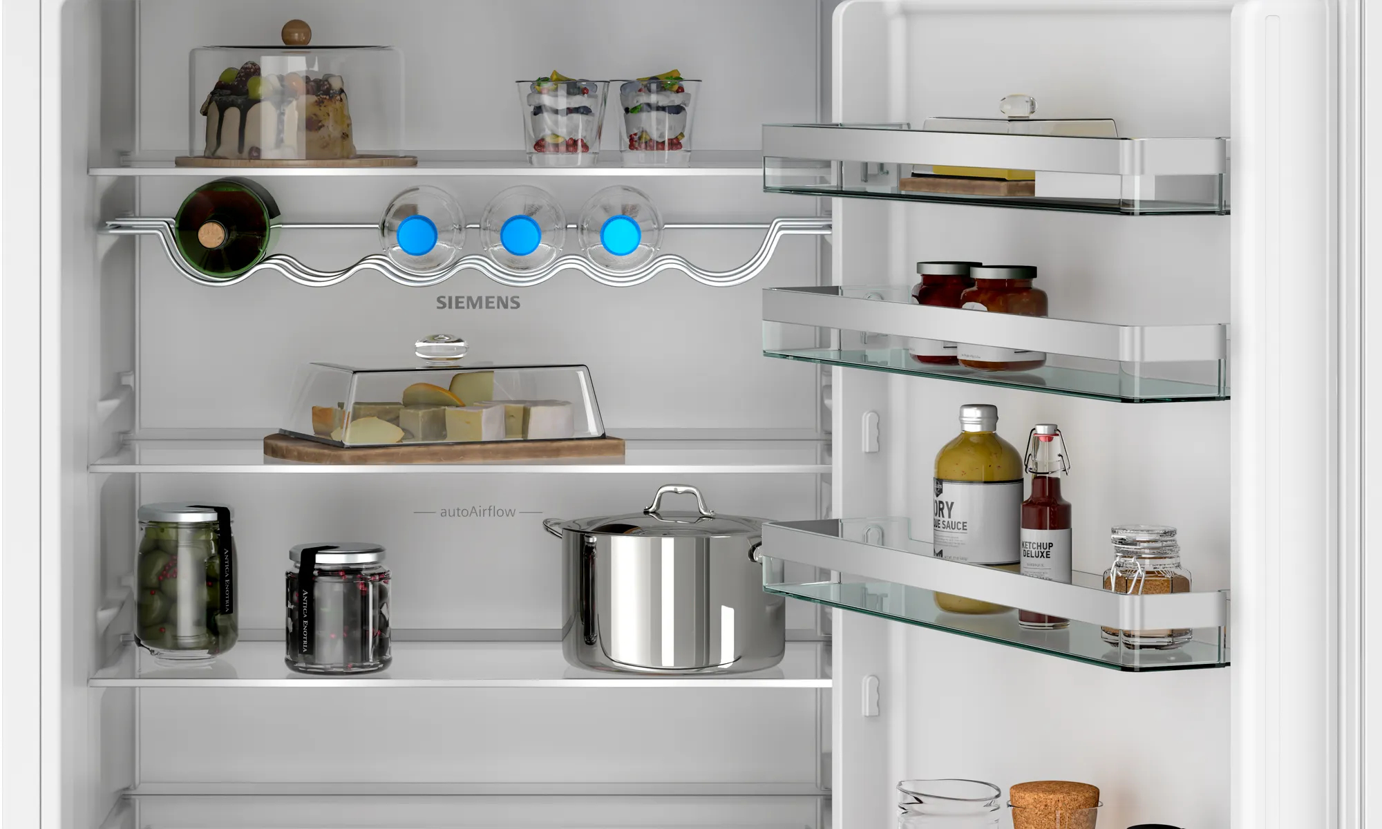 Refrigerador blanco con puertas abiertas, lleno de alimentos.