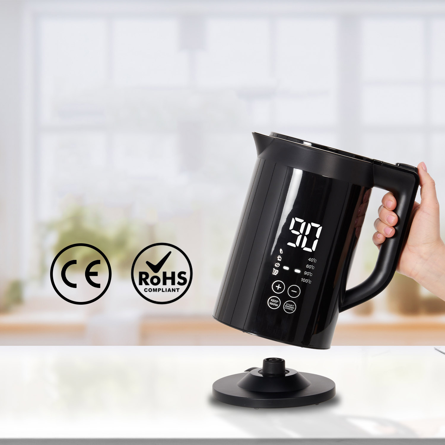 Black kettle on base, tilted by hand. Digital display reads 90. CE and RoHS logos are visible.