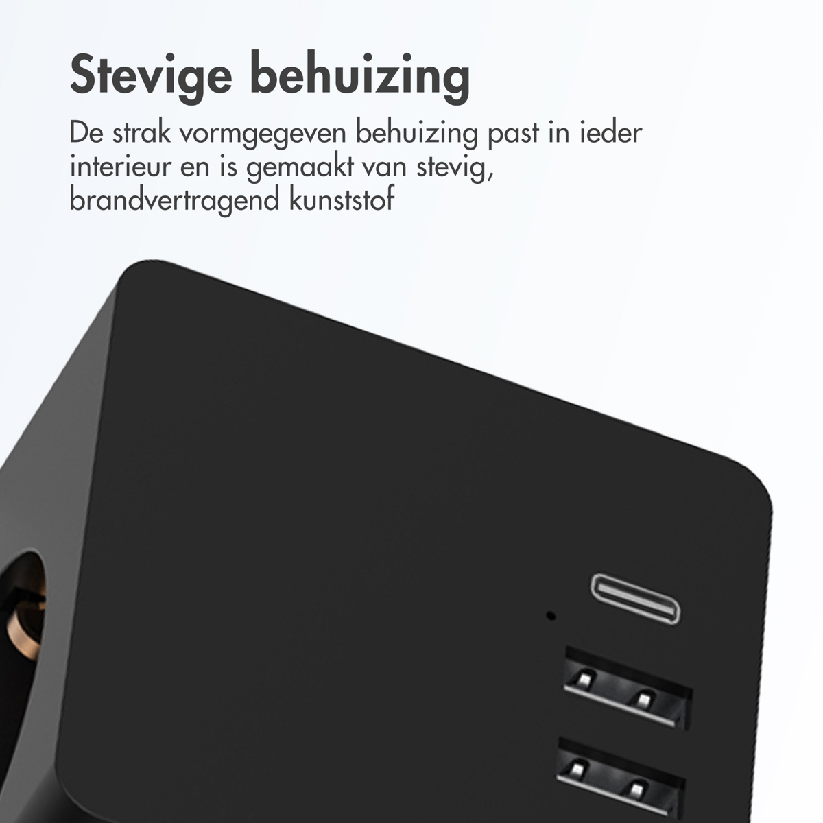 Black charging adapter with USB ports. White text above. Text: Sturdy housing. Made of fire-retardant plastic.