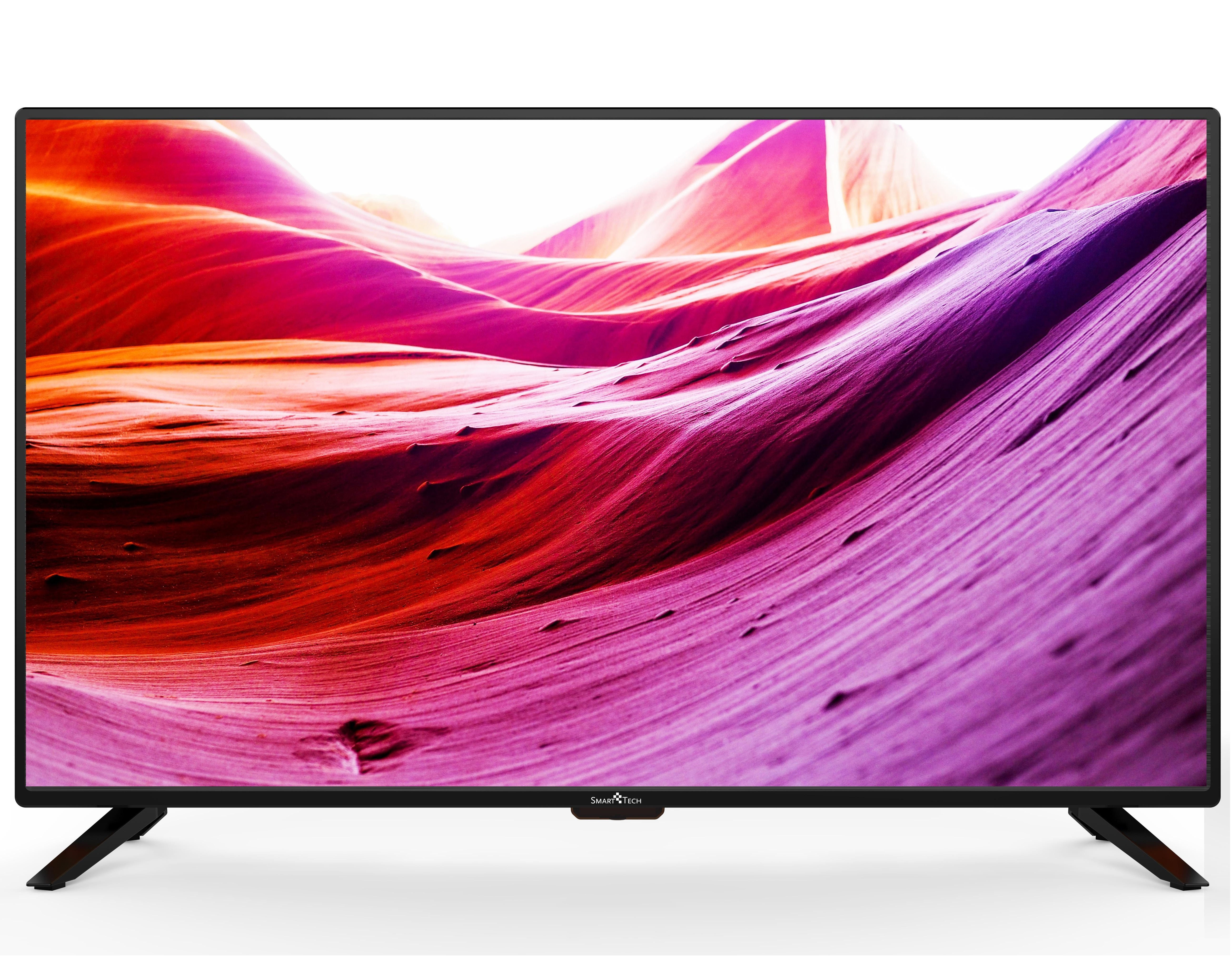 Uno schermo TV che mostra un paesaggio con sfumature di rosso e rosa. La TV ha gambe nere.