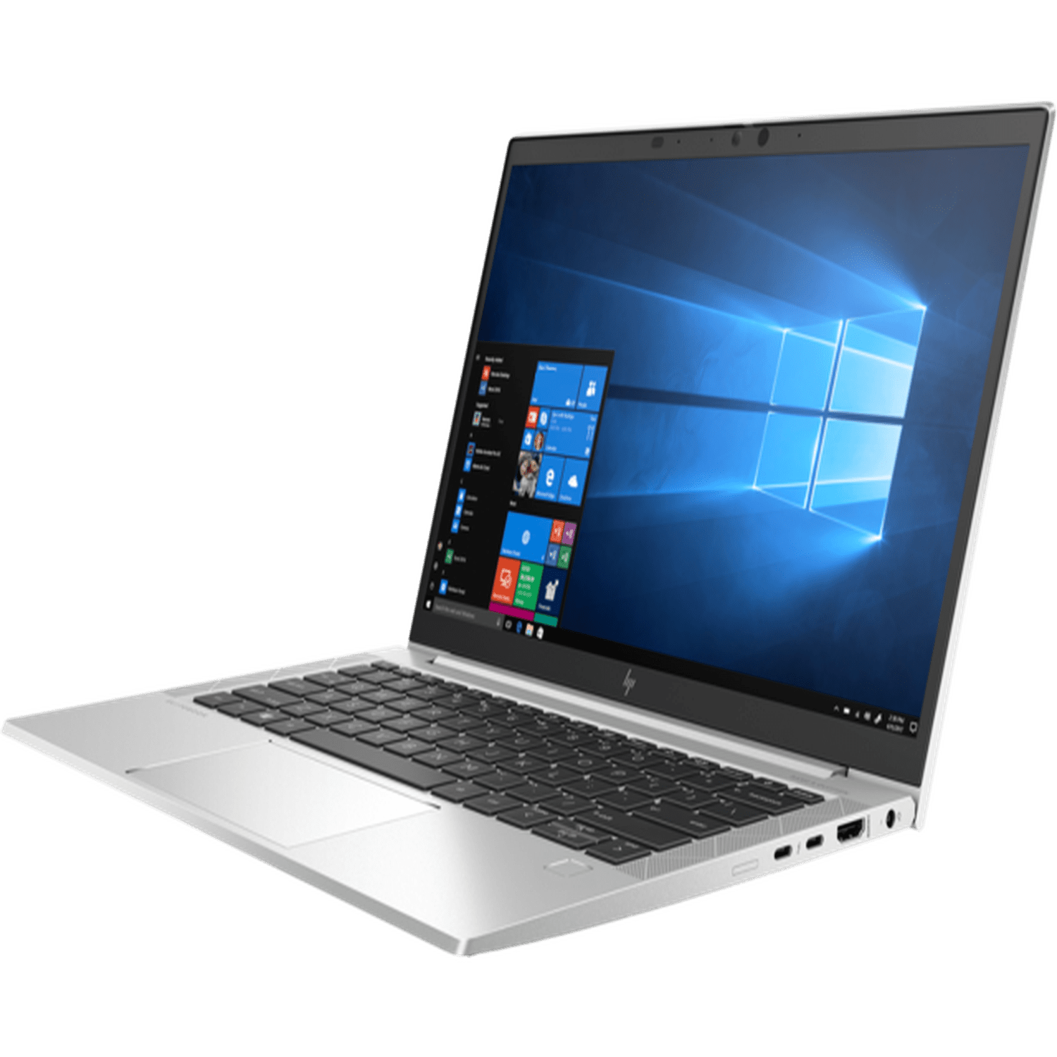 Silberner Laptop auf grünem Hintergrund, geöffnet, zeigt den Windows-Desktop.