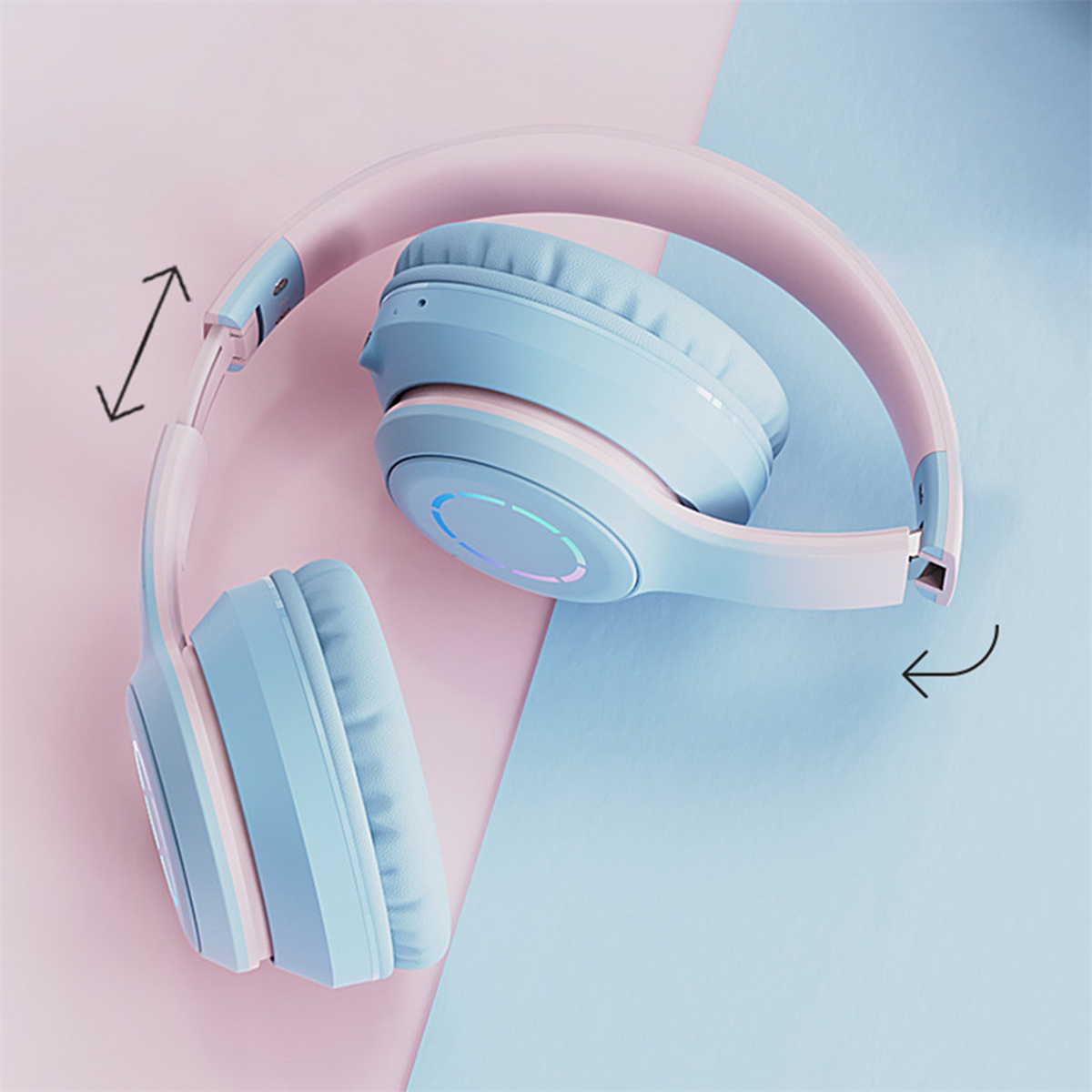 Blaue und rosa Kopfhörer, gefaltet und einstellbar, mit Pfeilzeichnung.