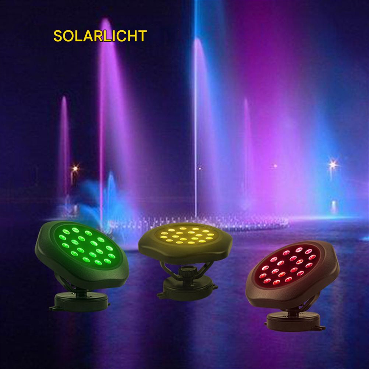 Drei farbige LED-Leuchten auf Ständern, mit Wasserfontänen im Hintergrund.