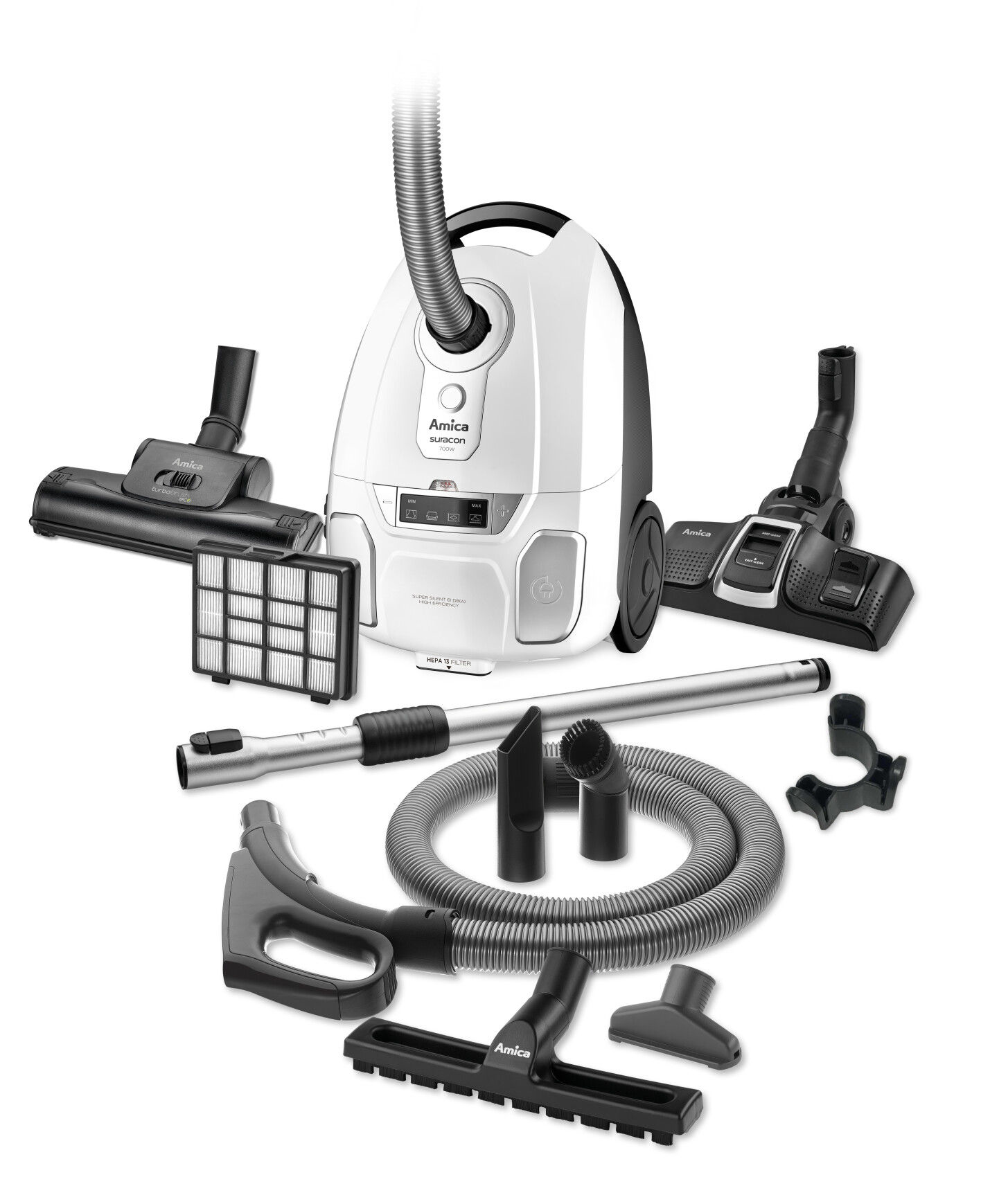White vacuum cleaner with multiple attachments. Accessories and parts arranged around the cleaner.