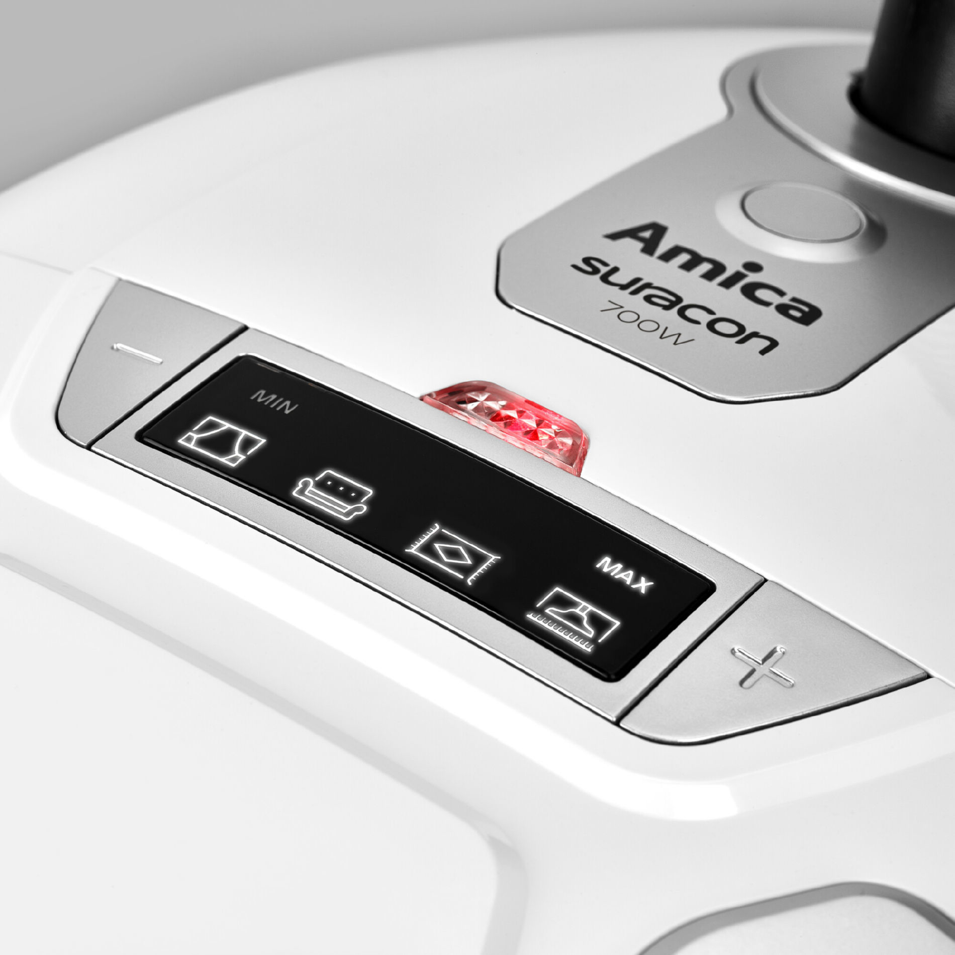 A close-up of a white appliance control panel with buttons and icons, labeled Amica Suracon.