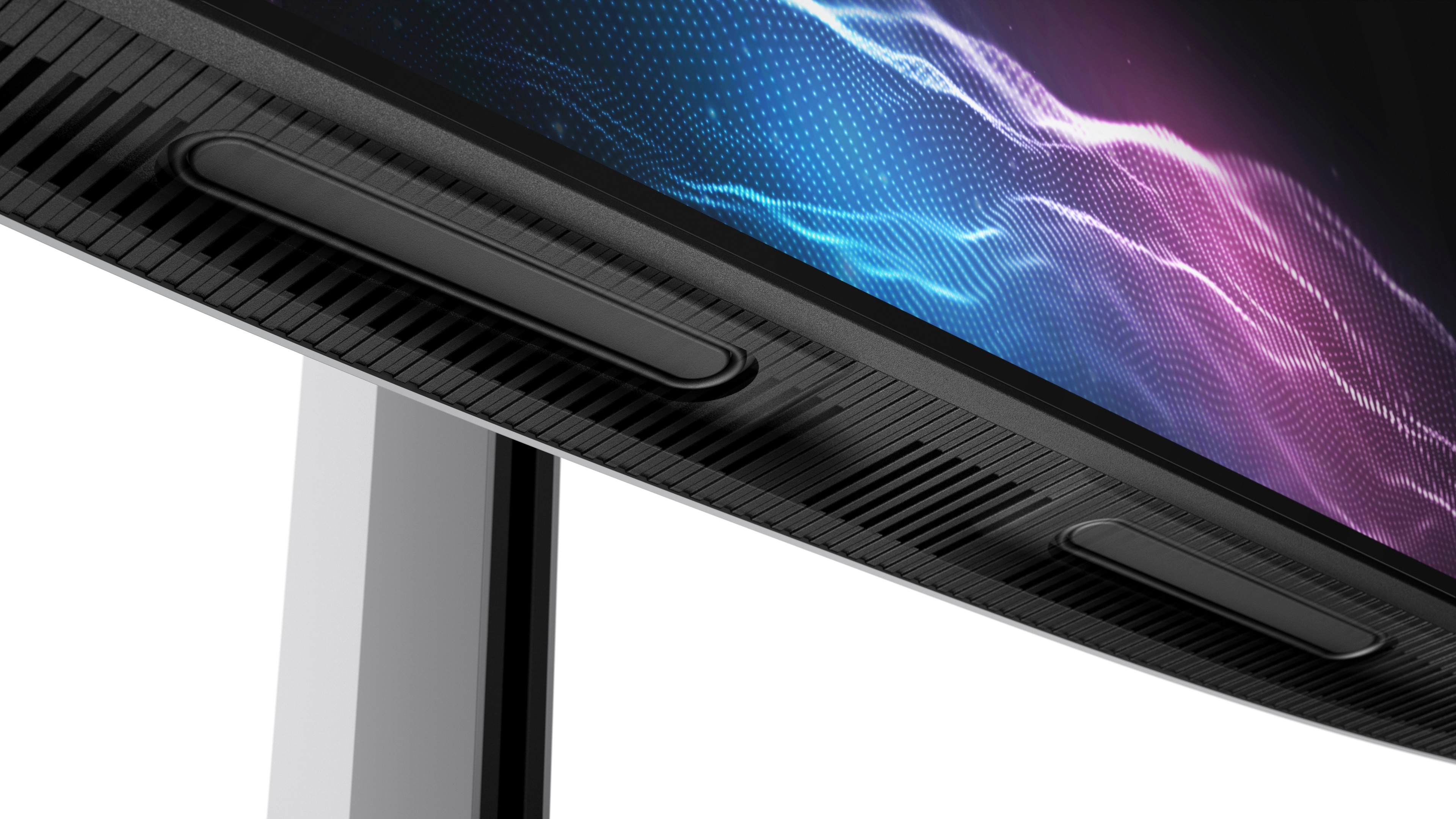 Zbliżenie dolnej części monitora, pokazujące otwory wentylacyjne, czarne paski i ekran.