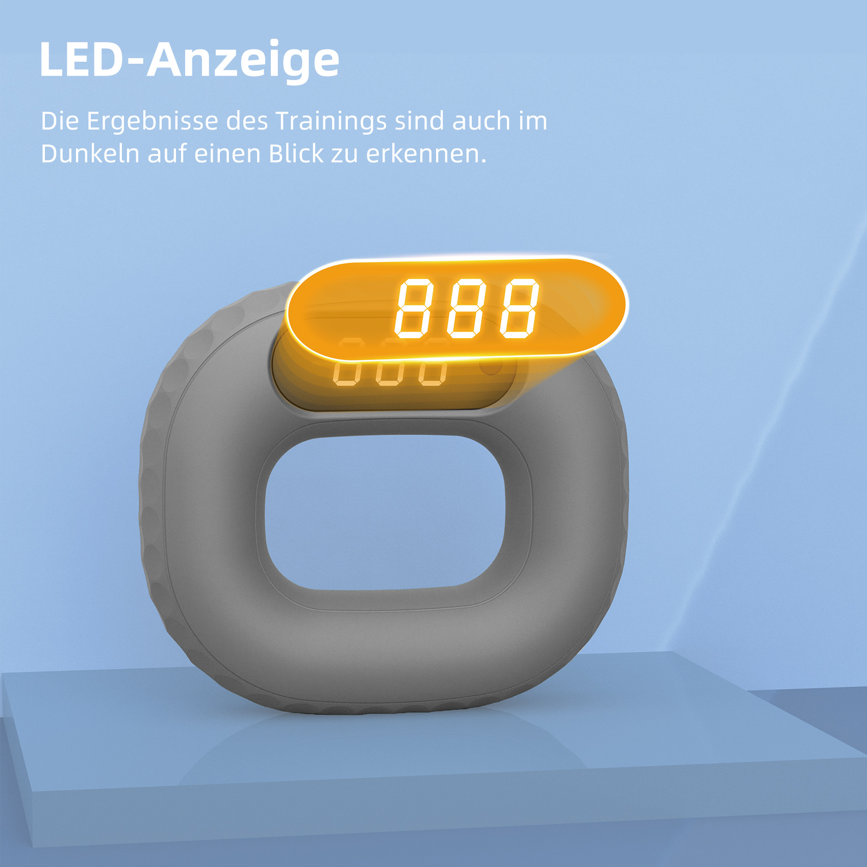 Graues Trainingsgerät mit orangefarbener Digitalanzeige.