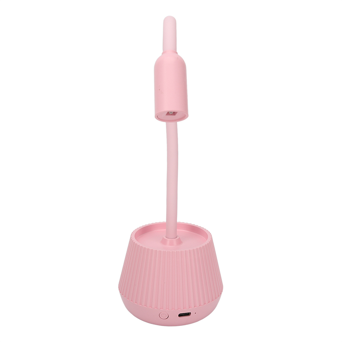 Rosa Schreibtischlampe mit zylindrischem Kopf und geripptem Sockel. Der Sockel hat einen Ladeanschluss.