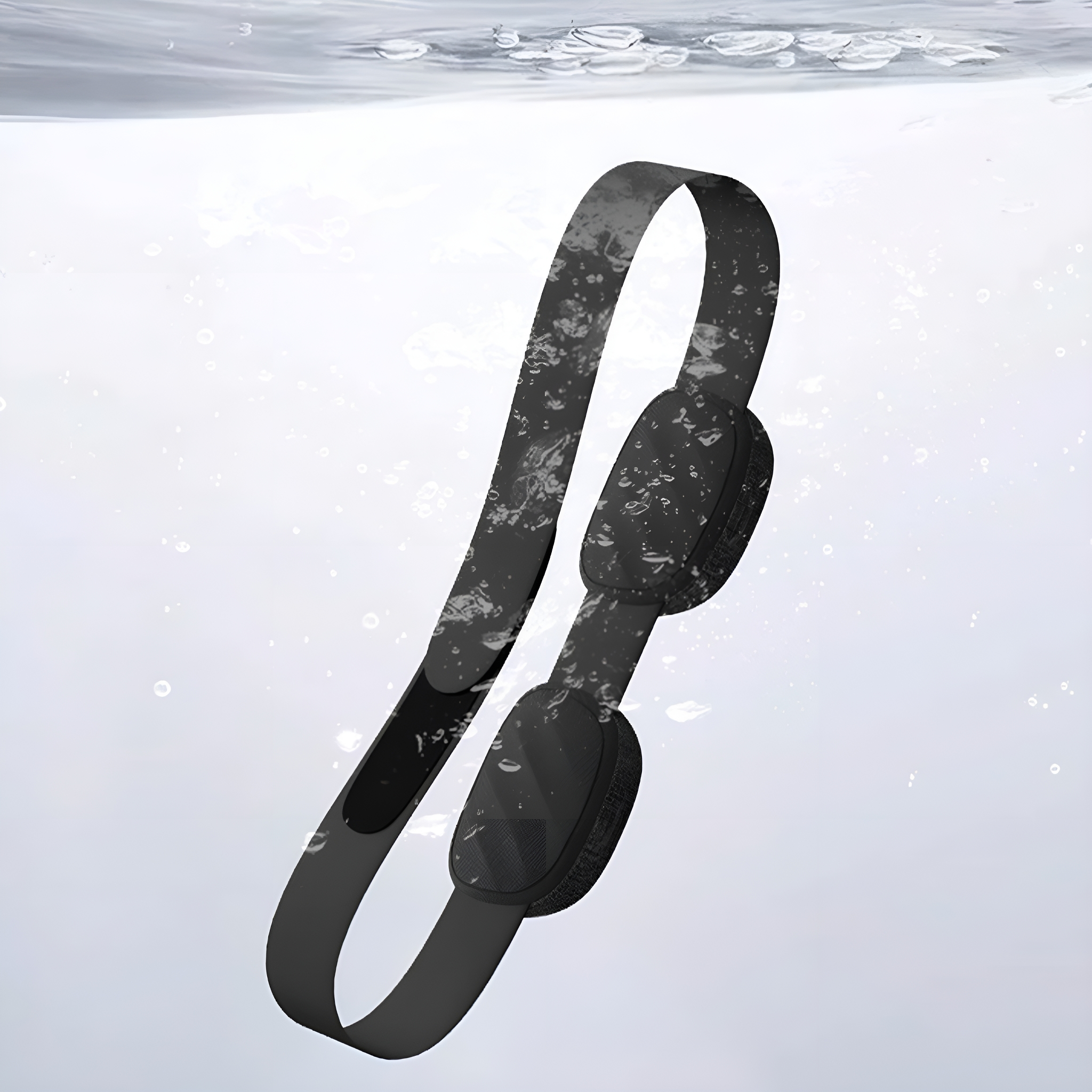 Schwarze Kopfhörer im Wasser mit Blasen darum. Die Kopfhörer sind gekrümmt.