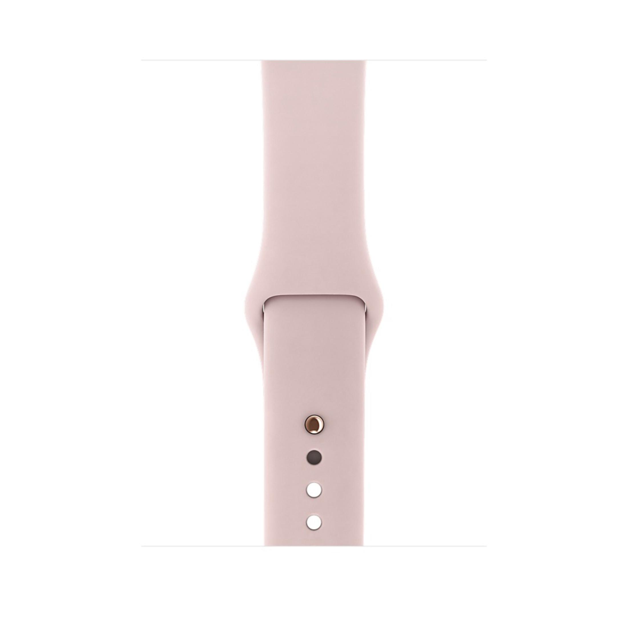 Hellrosa Apple Watch Armband, das den Bandanschluss und die Löcher für den Stift zeigt.