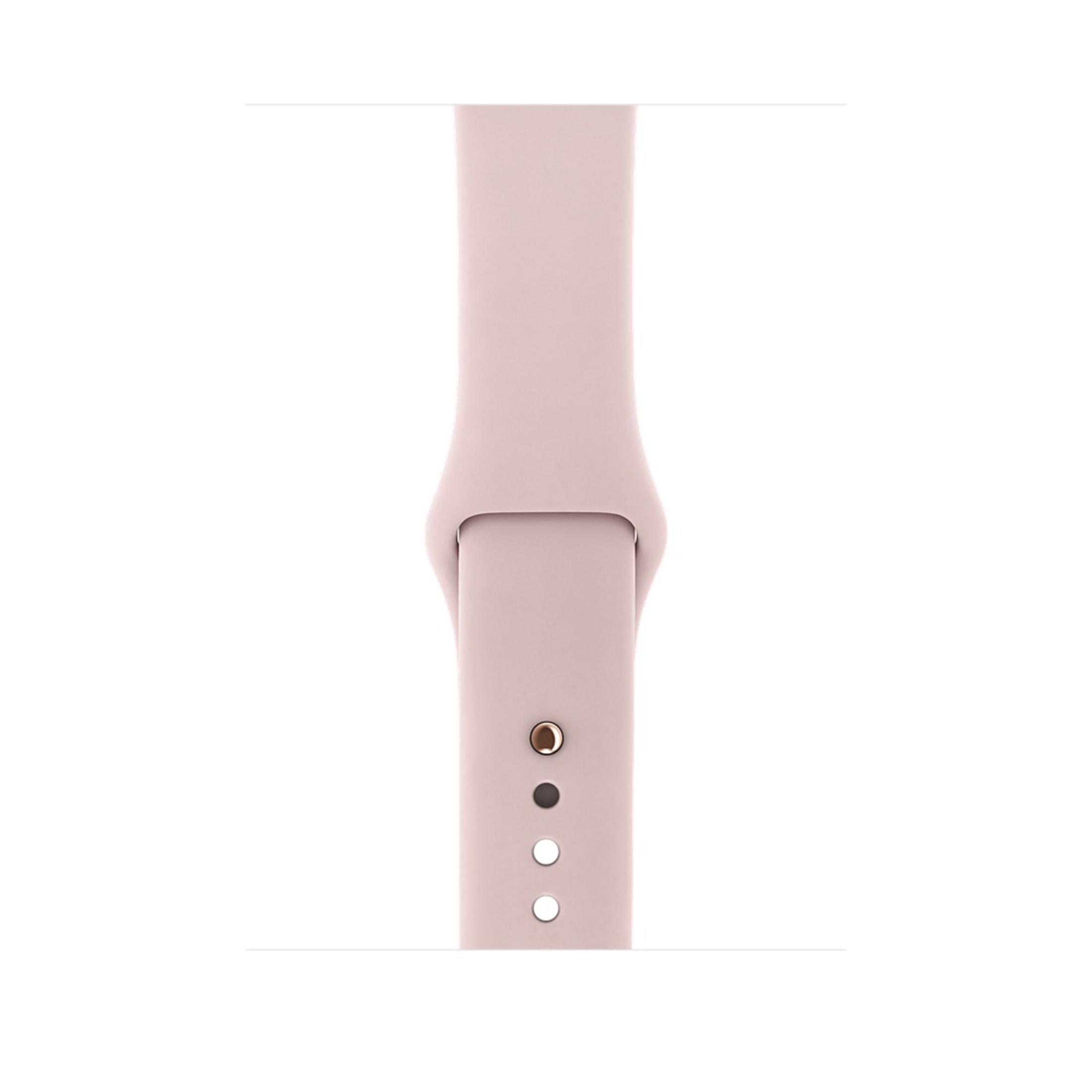 Nahaufnahme eines hellrosa Apple Watch Armbands mit drei Löchern.