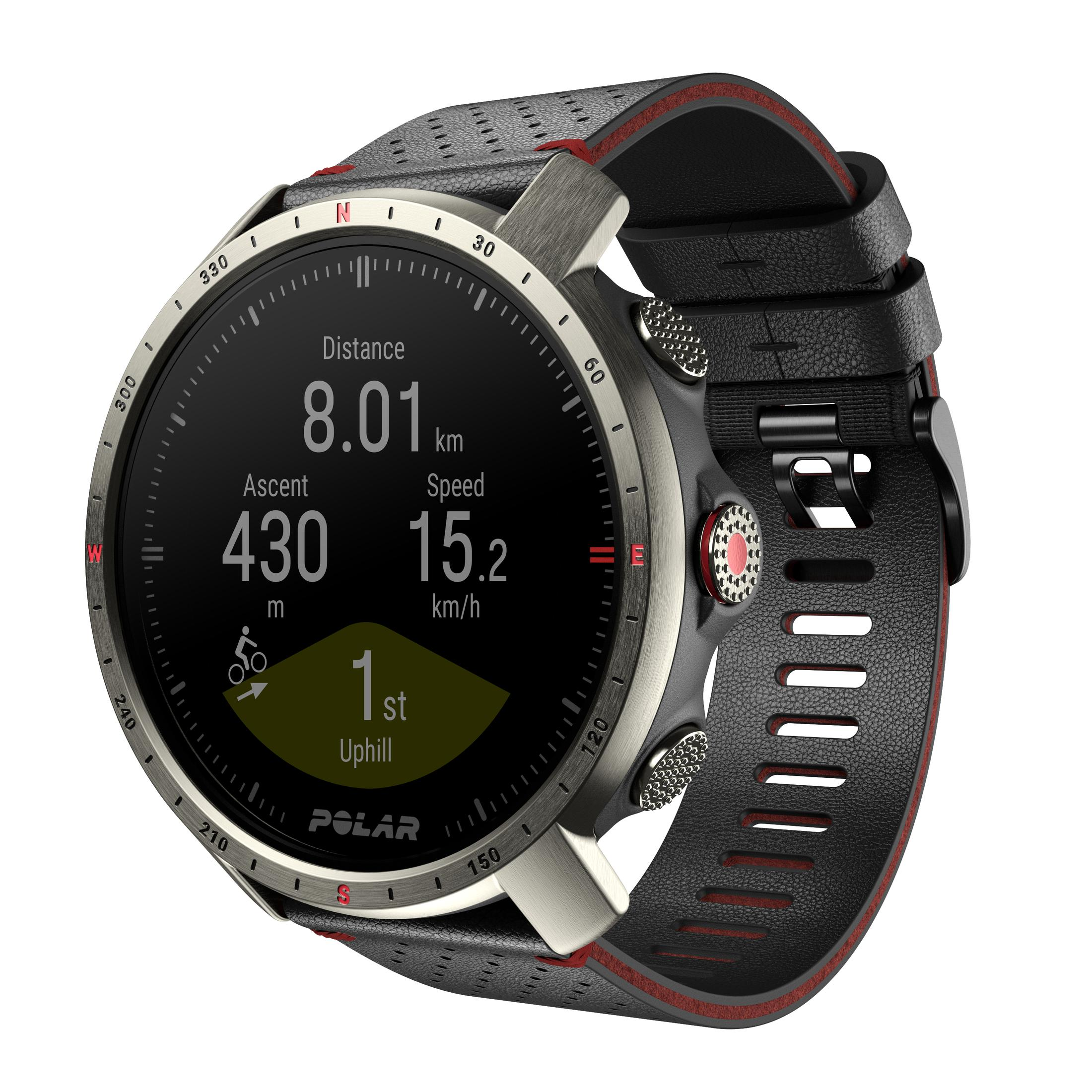 Un reloj GPS Polar con pantalla negra que muestra distancia, ascenso, velocidad y 1ª cuesta. Correa negra y gris.