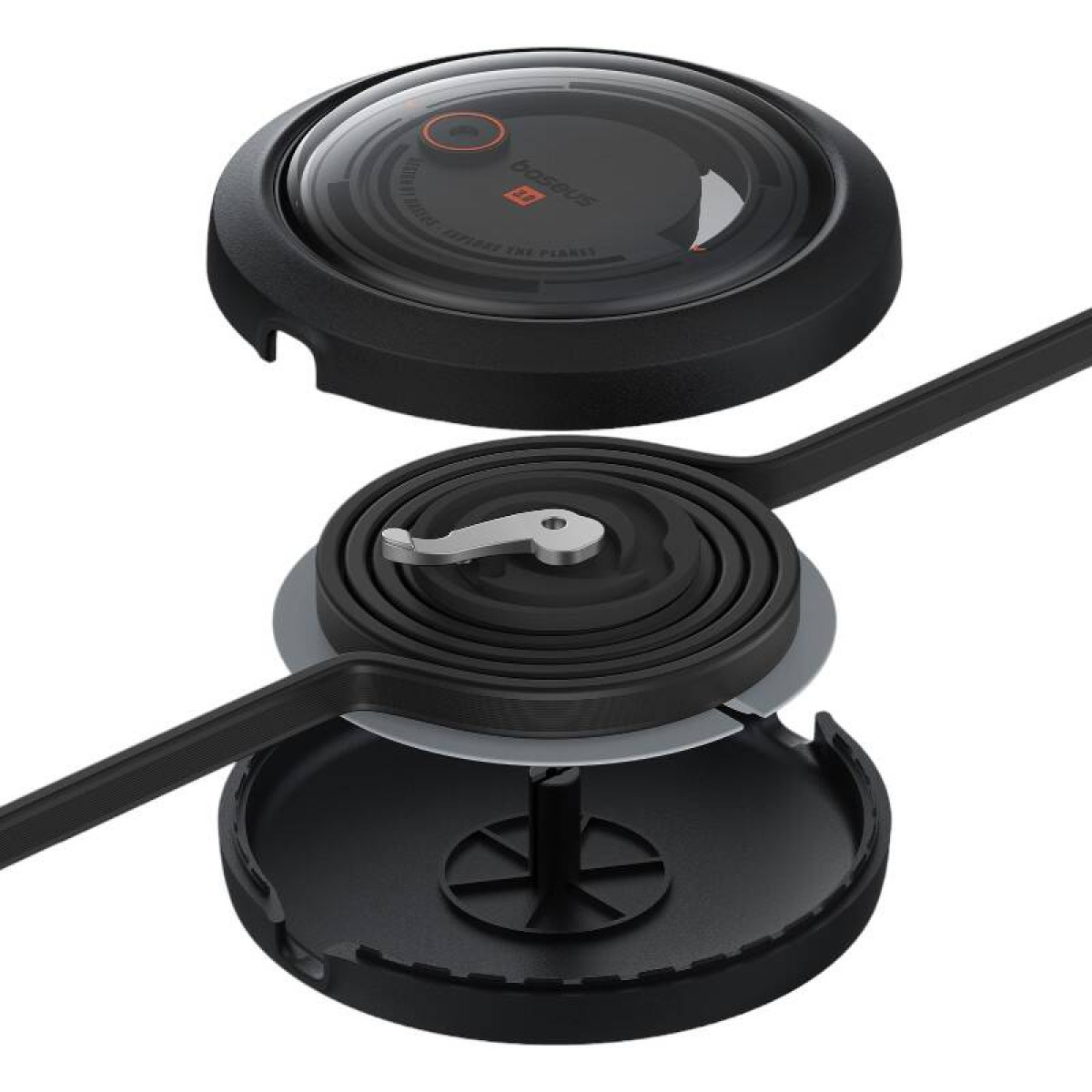 Czarne okrągłe urządzenie, zdemontowane. Pokazuje górę, sprężynę i podstawę. Na górze znajduje się tarcza.