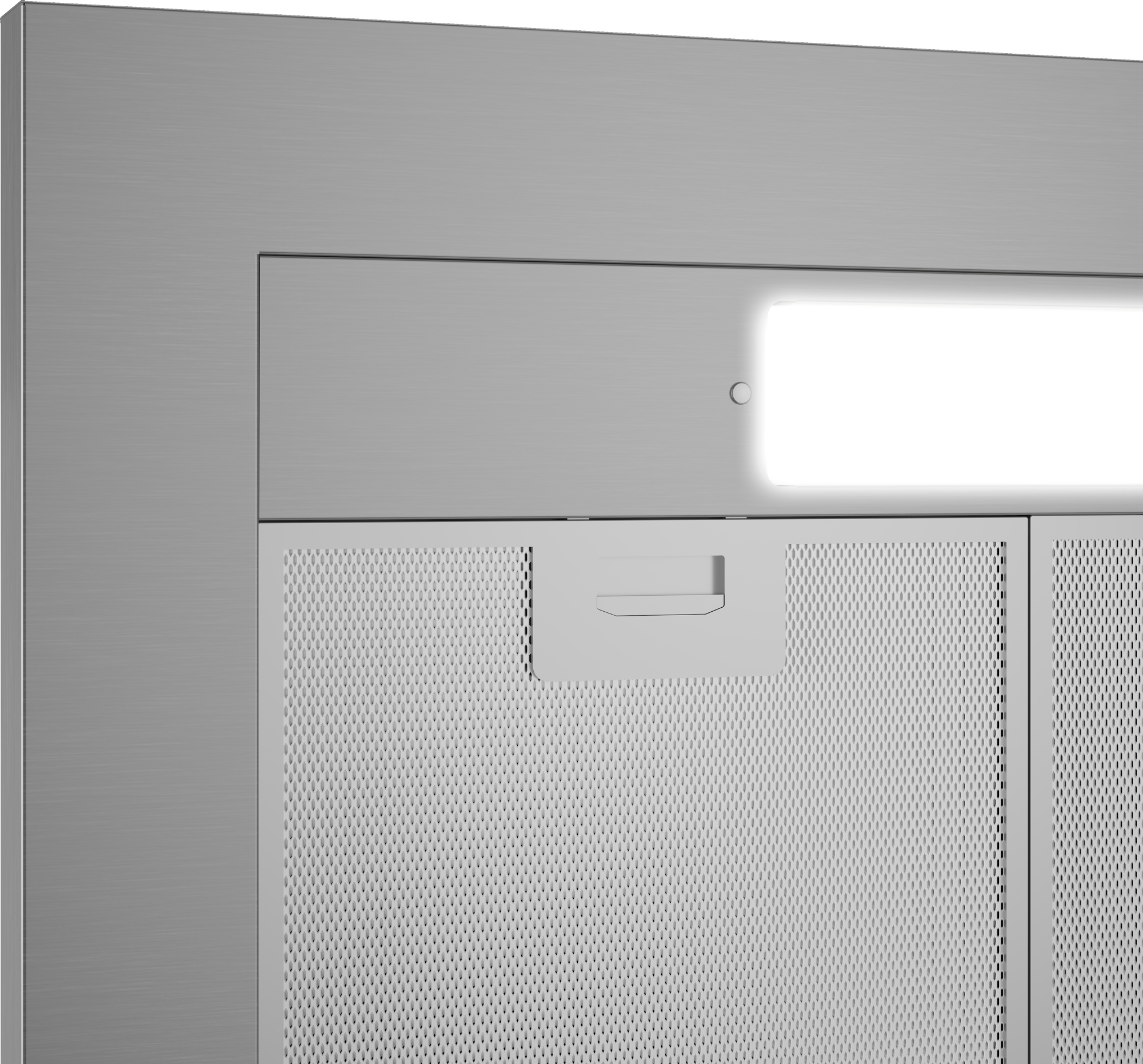 Primo piano di una cappa in acciaio inossidabile con luce e filtro visibili.