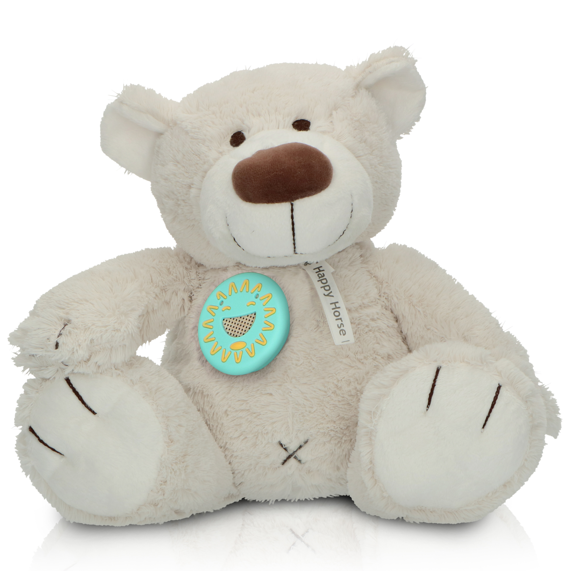 A white teddy bear with a blue sun-shaped button on its chest.