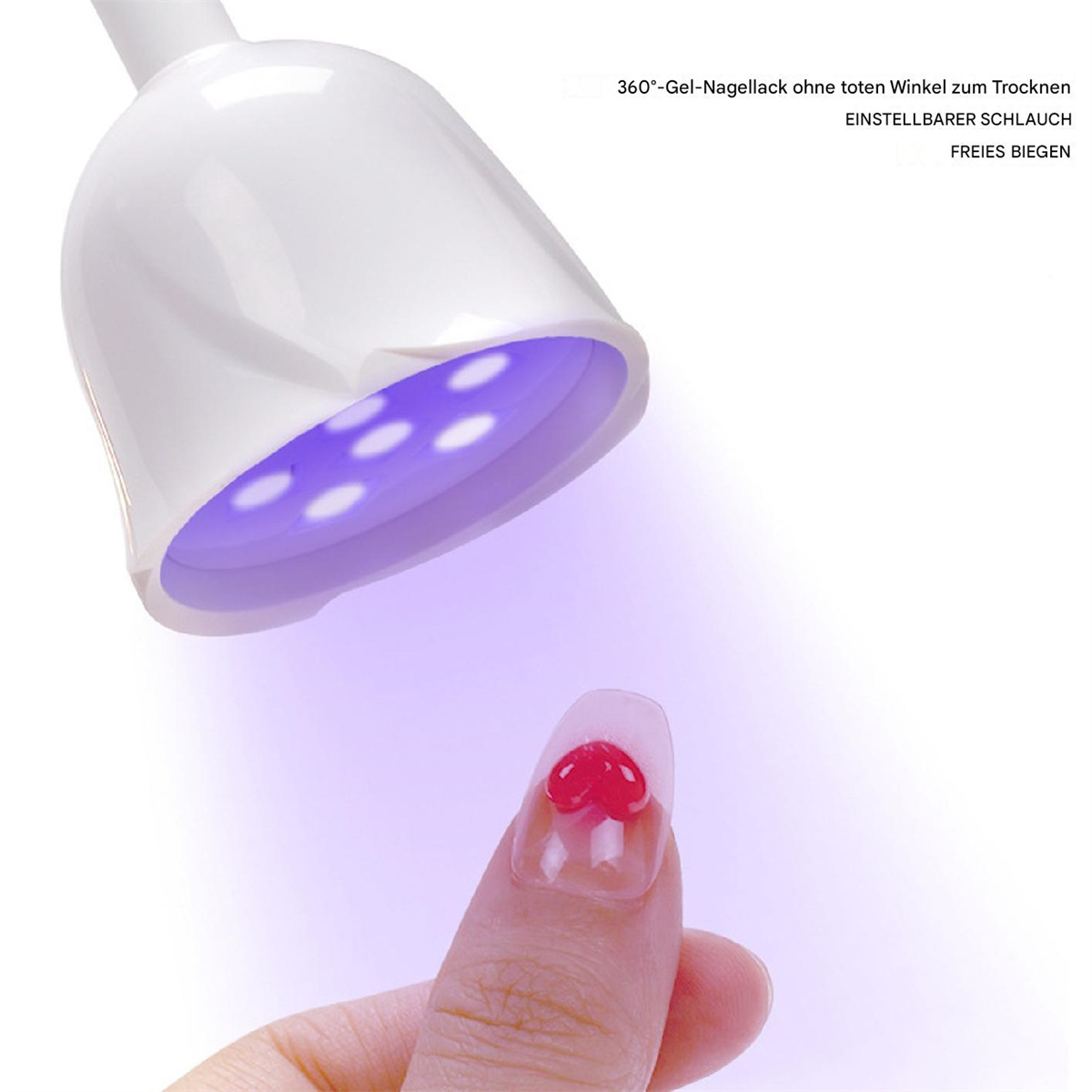 Nagellampe mit einem Nagel, der roten herzförmigen Gel-Lack zeigt, und einer Hand mit einem Nagel.