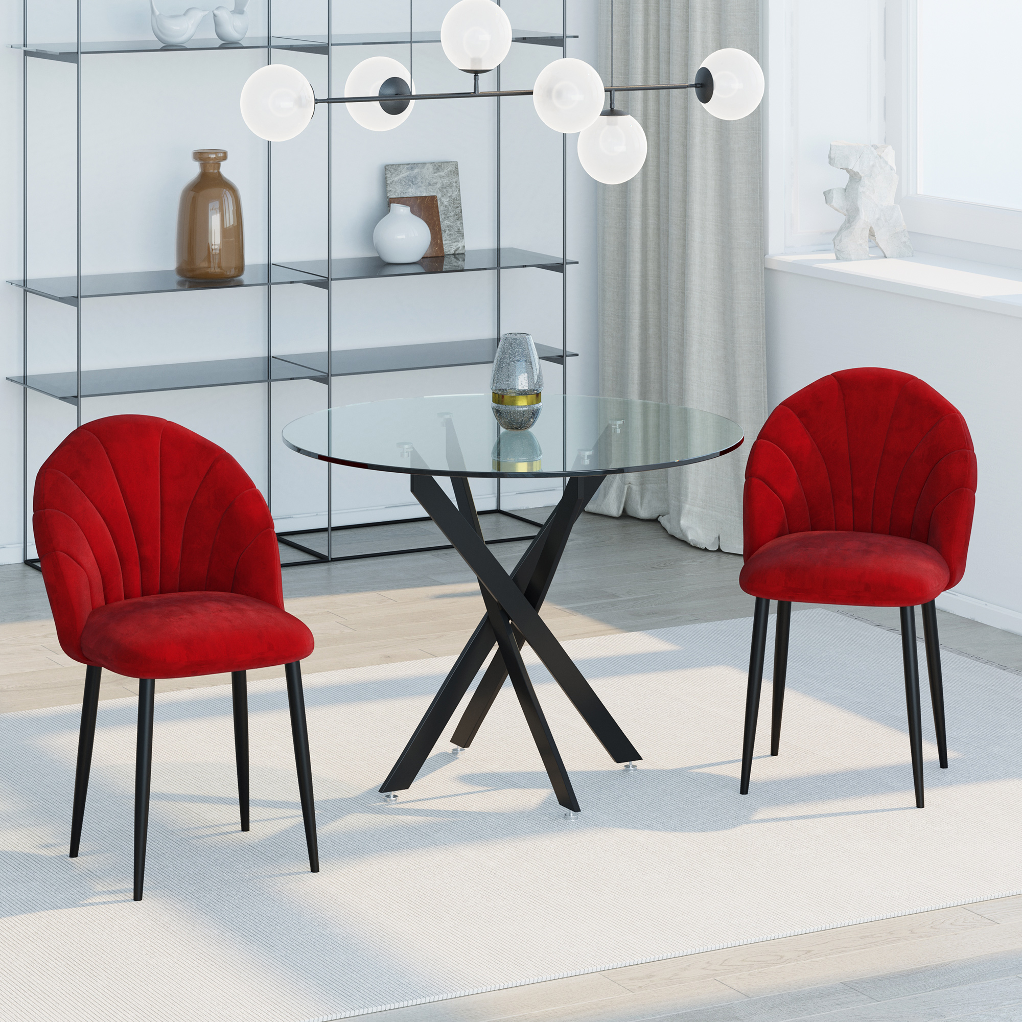 Un tavolo rotondo in vetro con due sedie rosse. Design moderno con base nera.