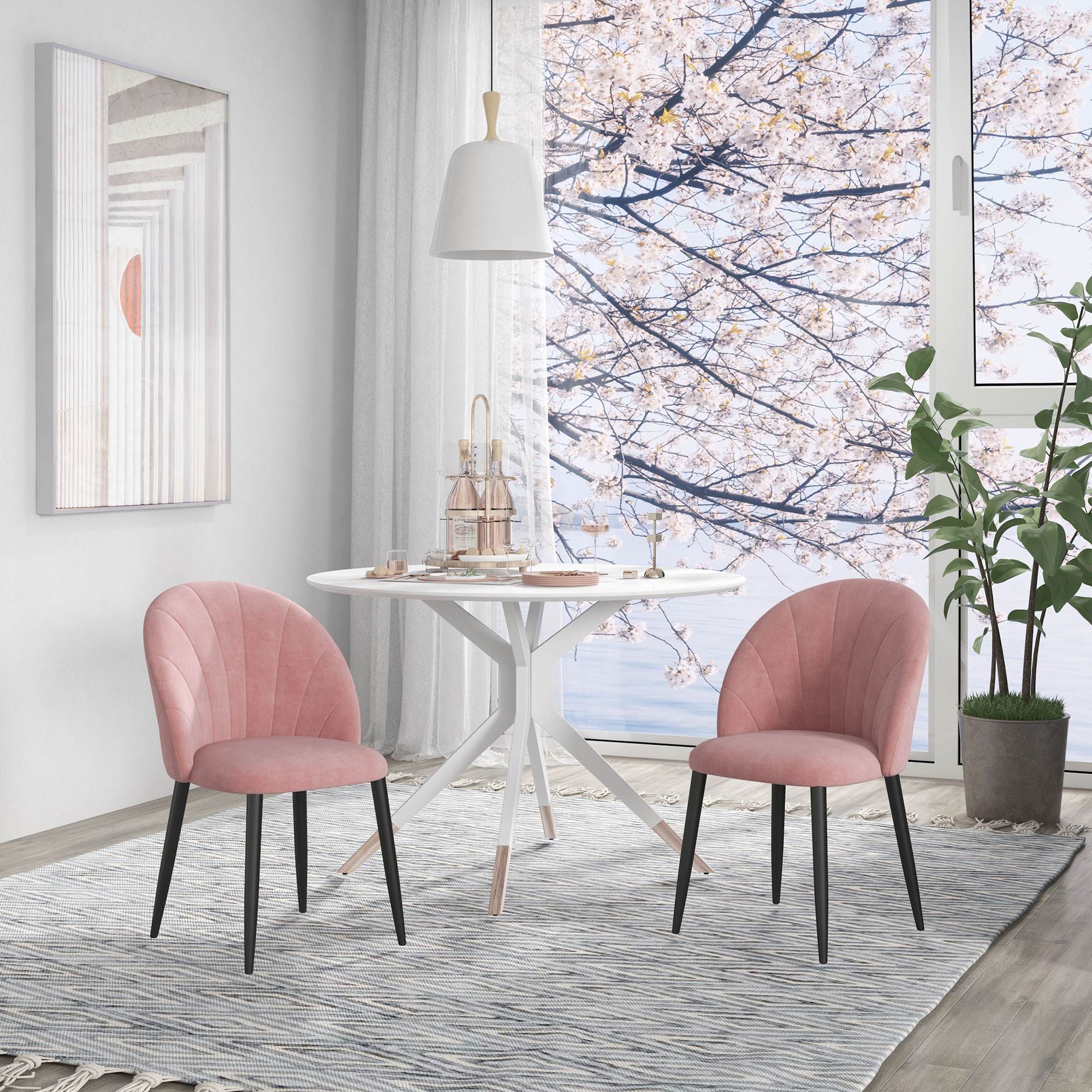 Zona pranzo con due sedie rosa, un tavolo bianco e una finestra con vista floreale.