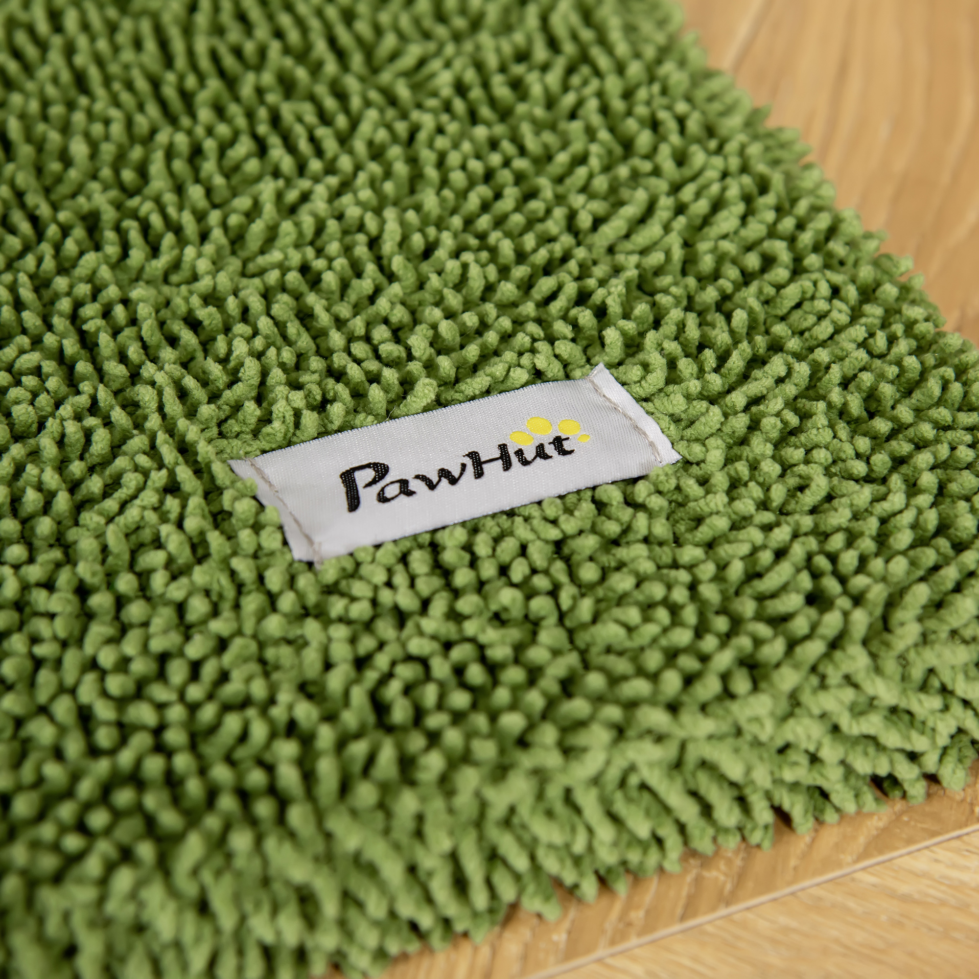 Tappetino da bagno verde con un'etichetta PawHut.
