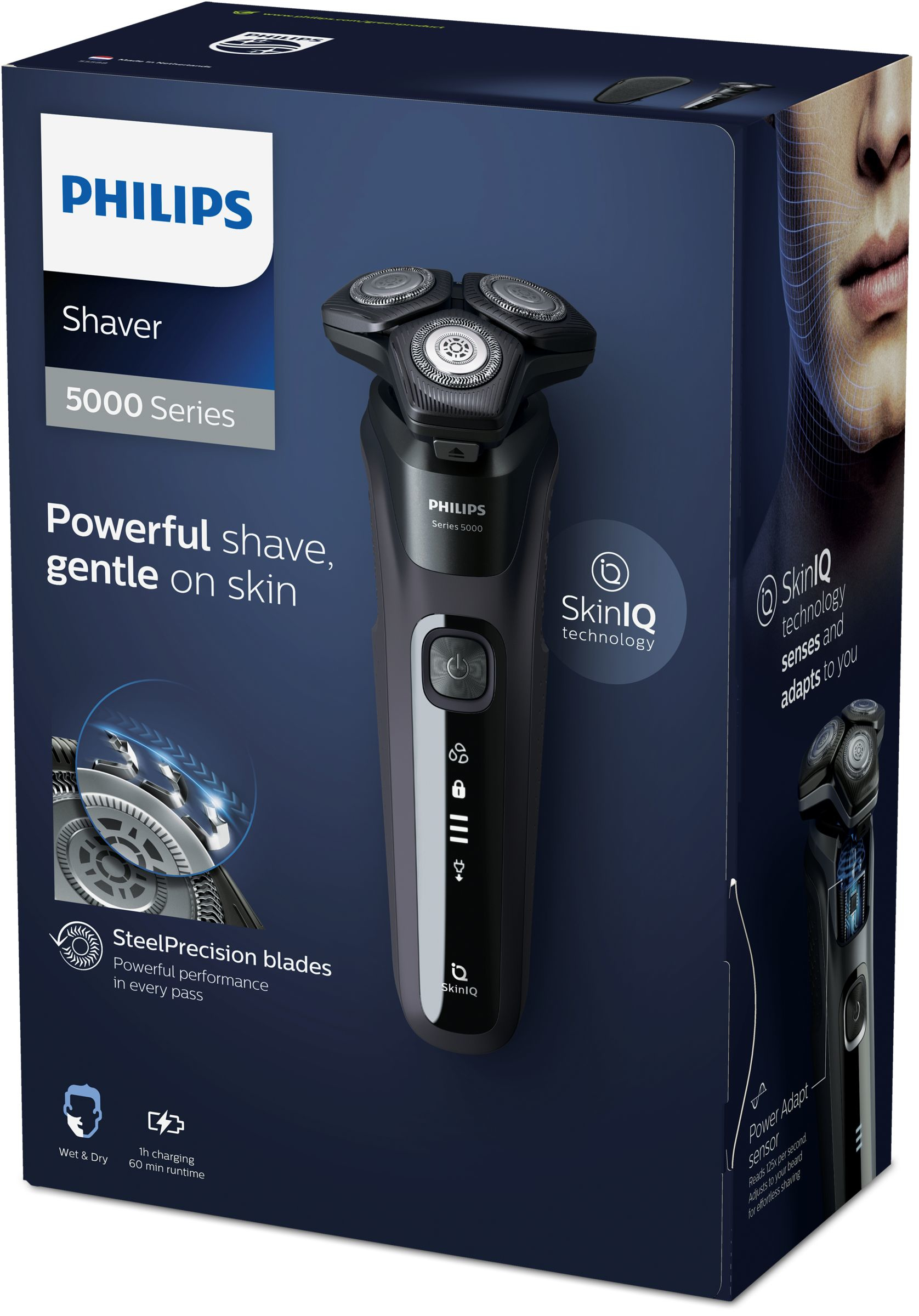 Caja de afeitadora Philips. Es una serie 5000. La afeitadora es negra y gris. Hay una cara de hombre en el lateral de la caja.