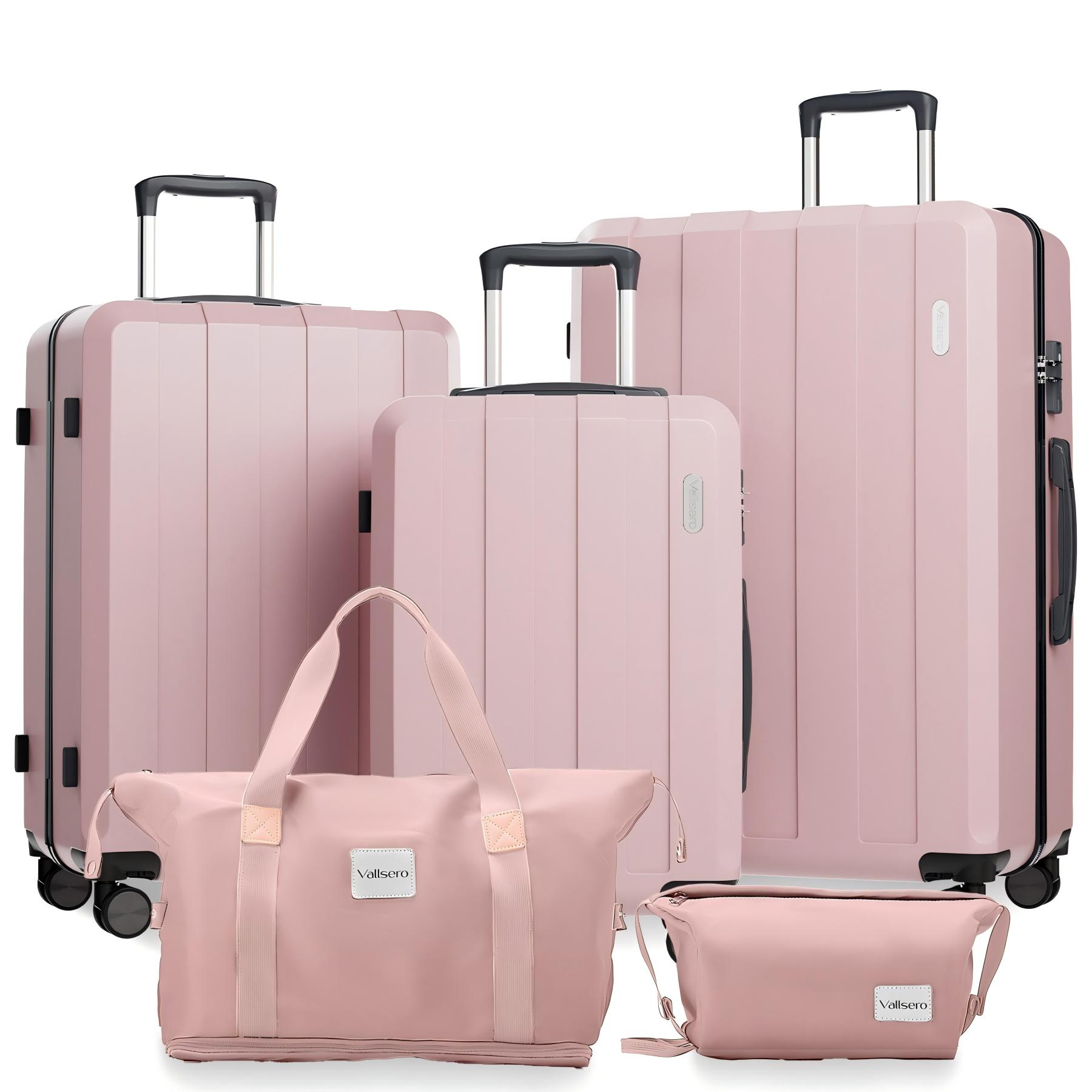 Ein Satz pinkfarbener Koffer sowie eine passende Tragetasche und eine kleine Tasche.