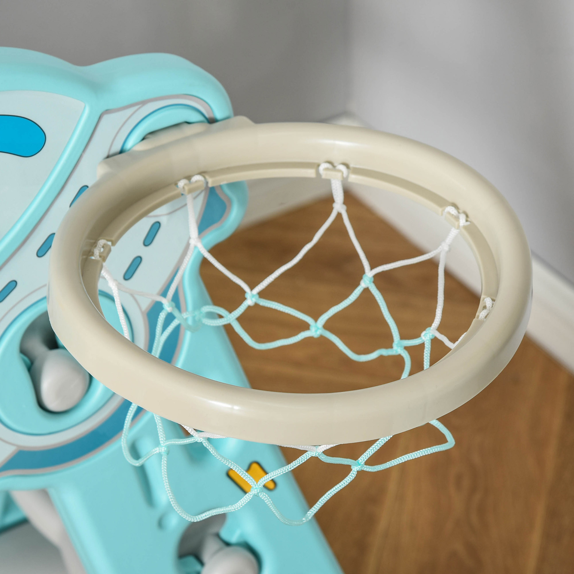 Un'altalena per bambini bianca con sedile blu e struttura di supporto gialla.