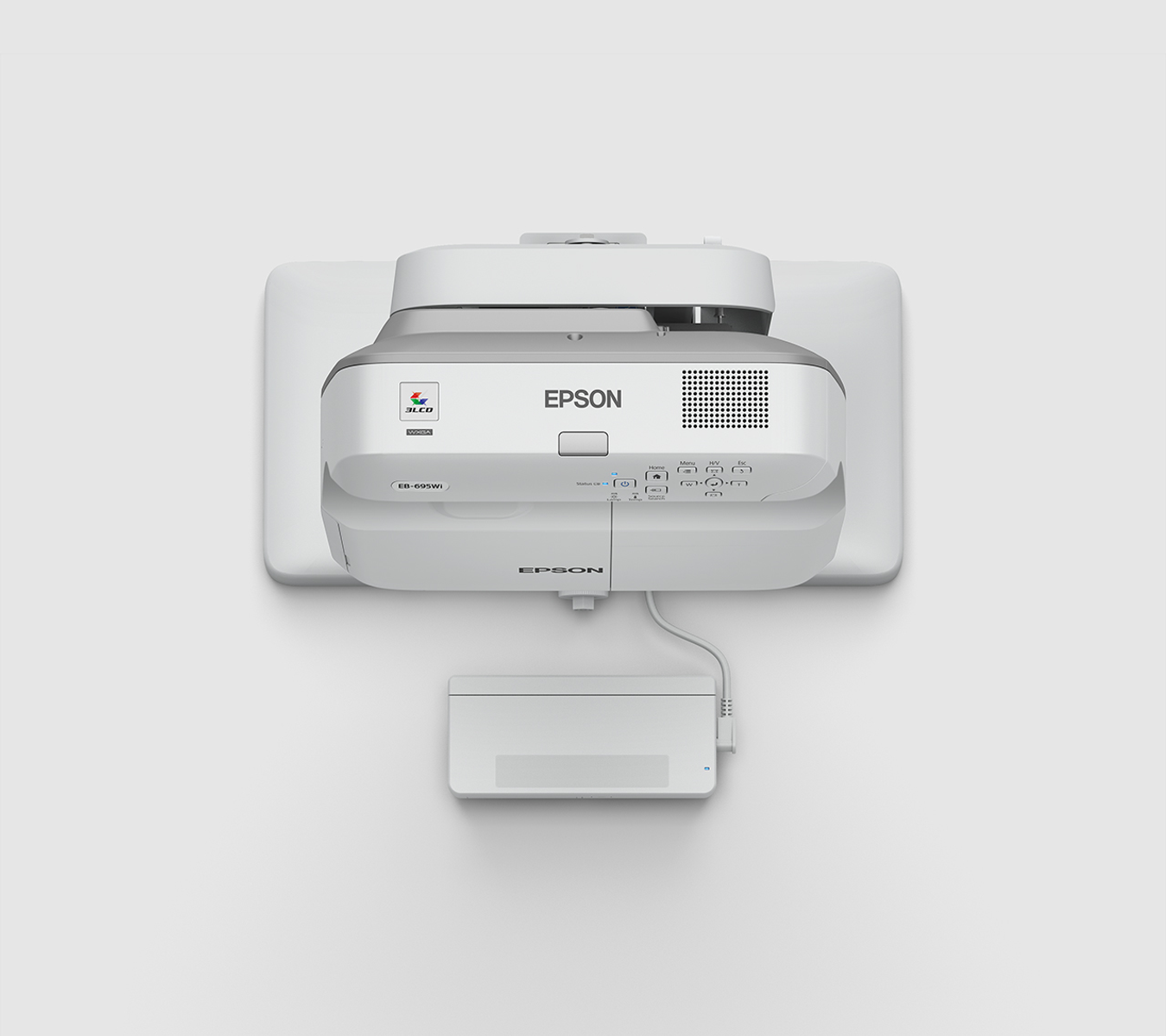 Proyector Epson blanco sobre soporte blanco. Logotipo Epson visible. Forma rectangular.
