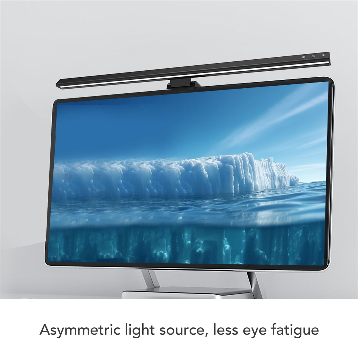 Ein Computermonitor mit einer schwarzen Lichtleiste darüber. Der Bildschirm zeigt einen Eisberg.