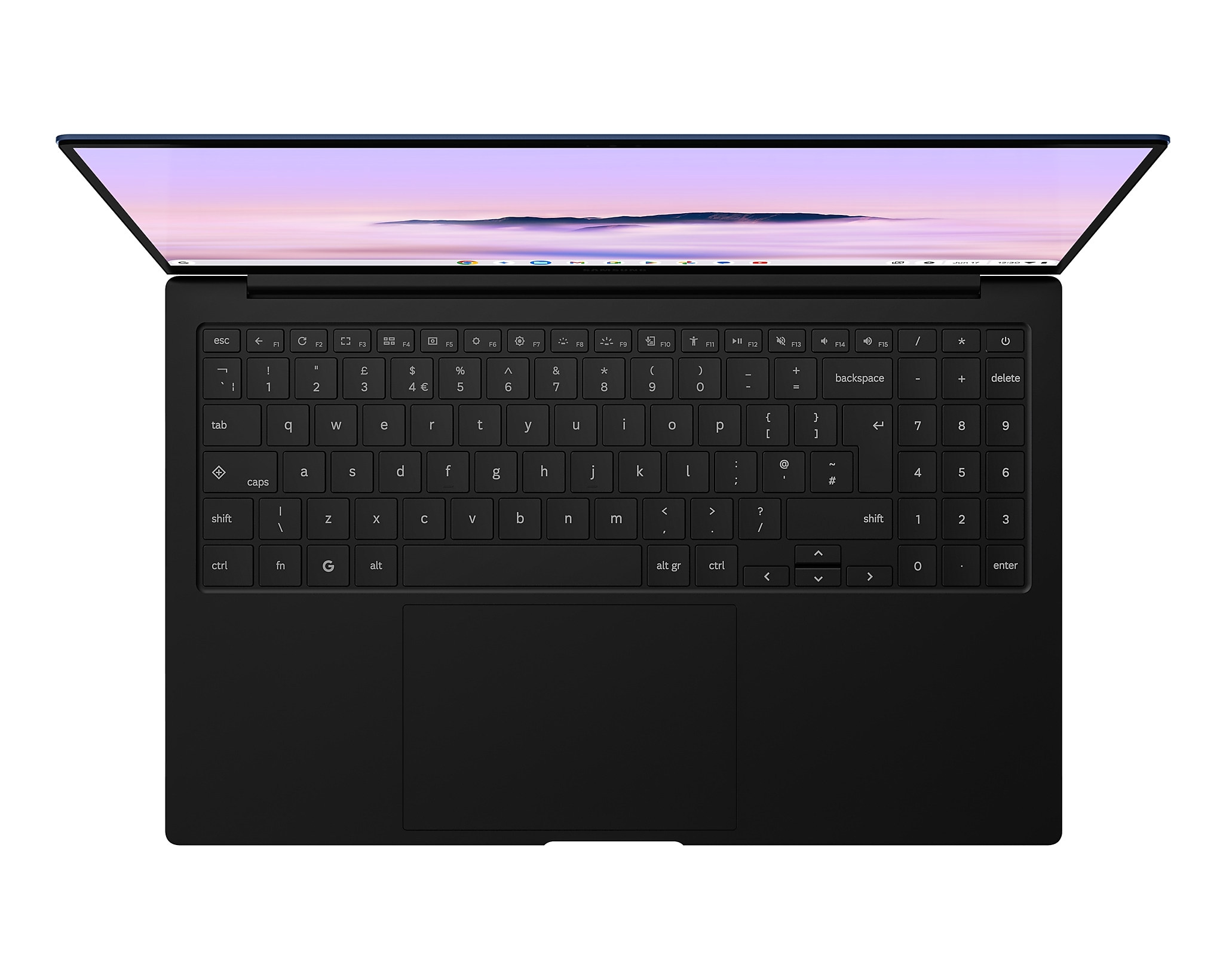 Scatto dall'alto di una tastiera e touchpad neri di un laptop, lo schermo mostra una scena di montagna.