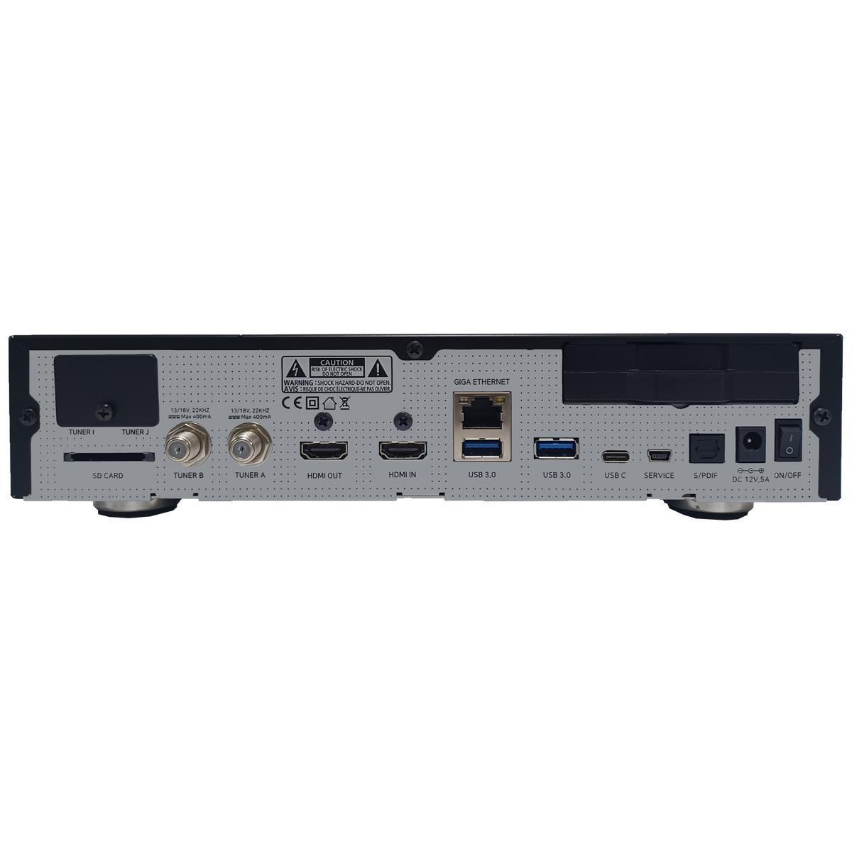 Rückseite eines schwarzen Geräts mit mehreren Anschlüssen, einschließlich HDMI, USB und Strom.
