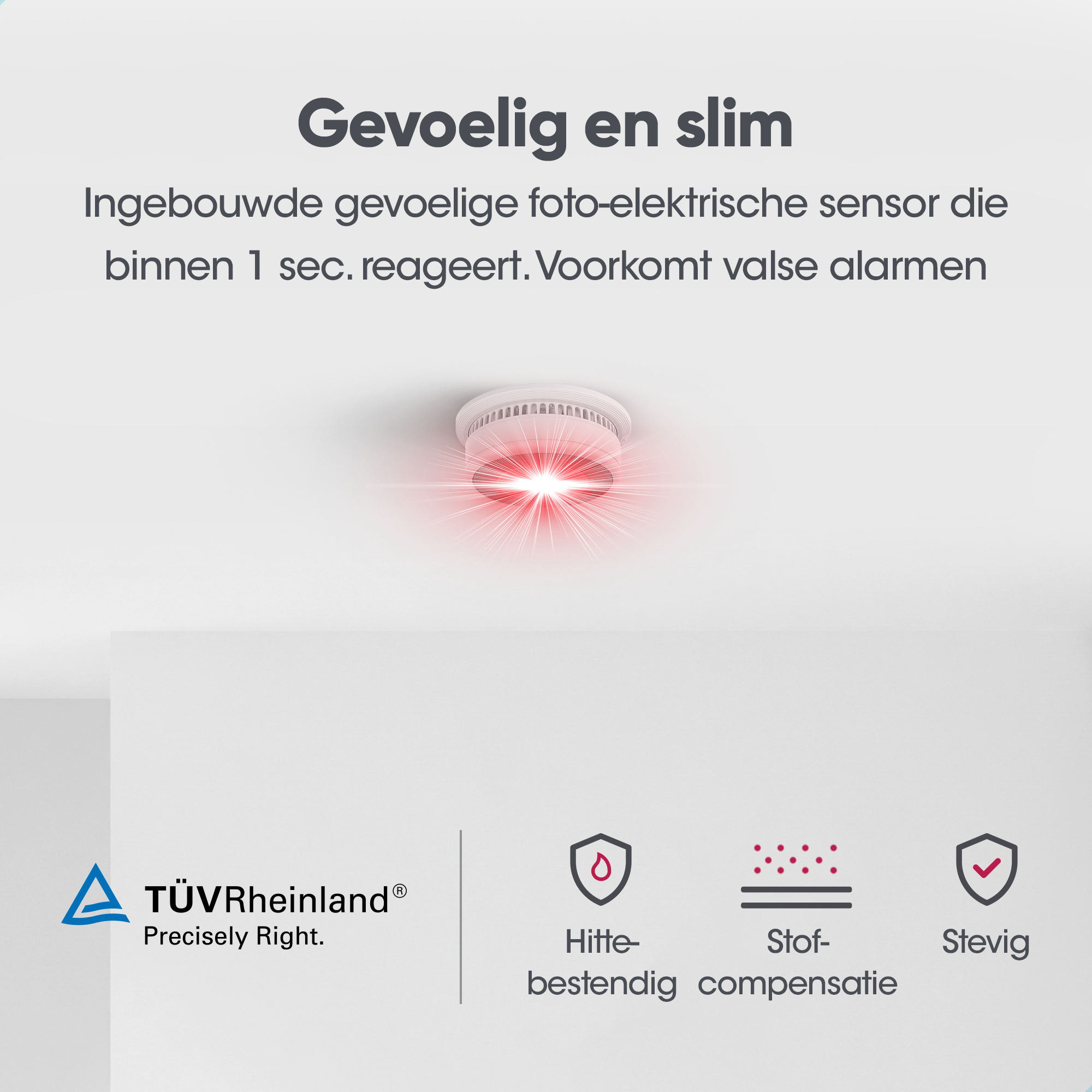 Rauchmelder mit rotem Licht und Symbolen für Hitzebeständigkeit und Staubkompensation.