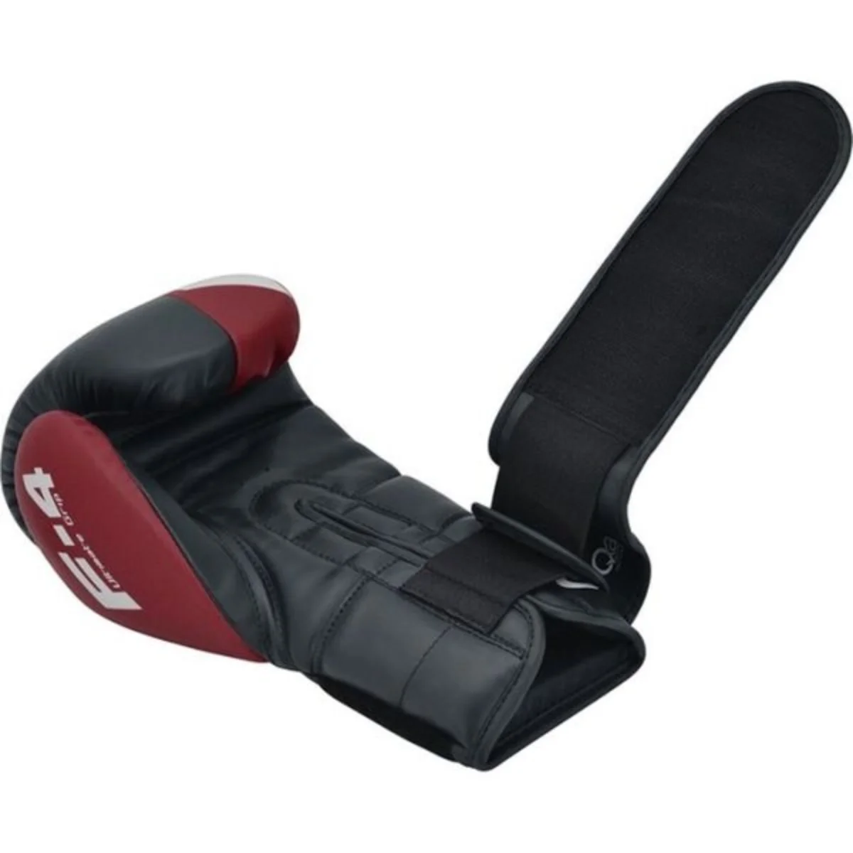 Red and black boxing glove with a black wrist strap, open, ready for use.