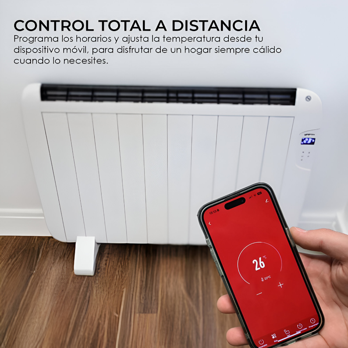 Una persona usa un smartphone para controlar un radiador blanco con pantalla roja y 26 grados.