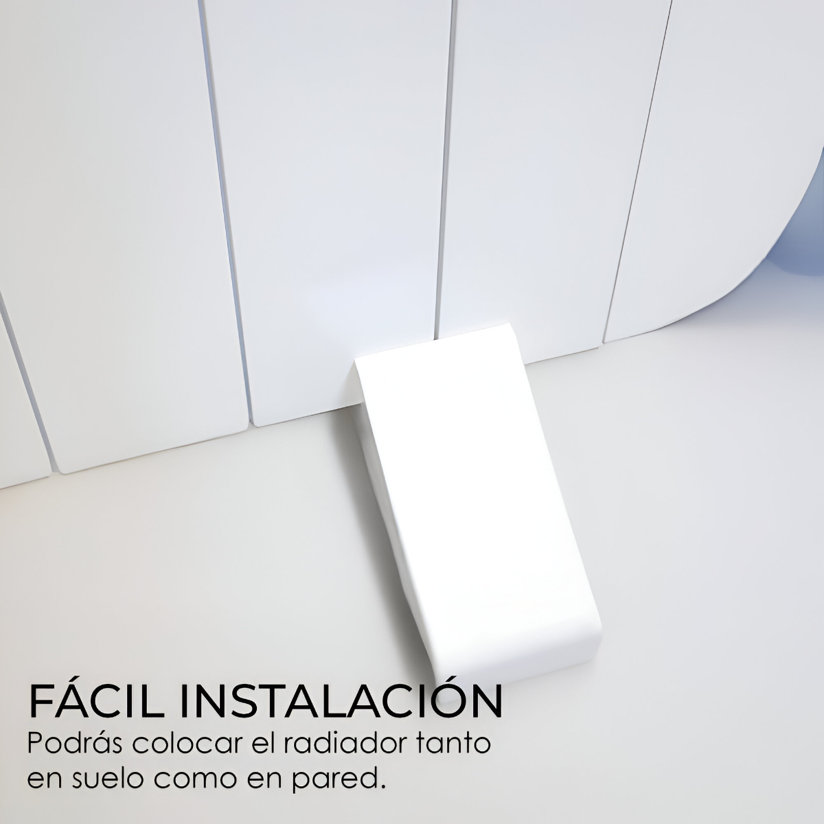 Un radiador blanco y rectangular con una pared blanca detrás y texto en español.