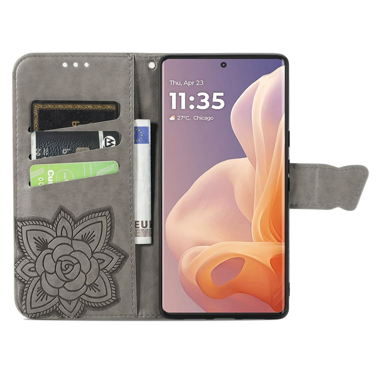Eine graue Handyhülle mit Kartenfächern, Blumendesign und Smartphone mit angezeigter Uhrzeit.