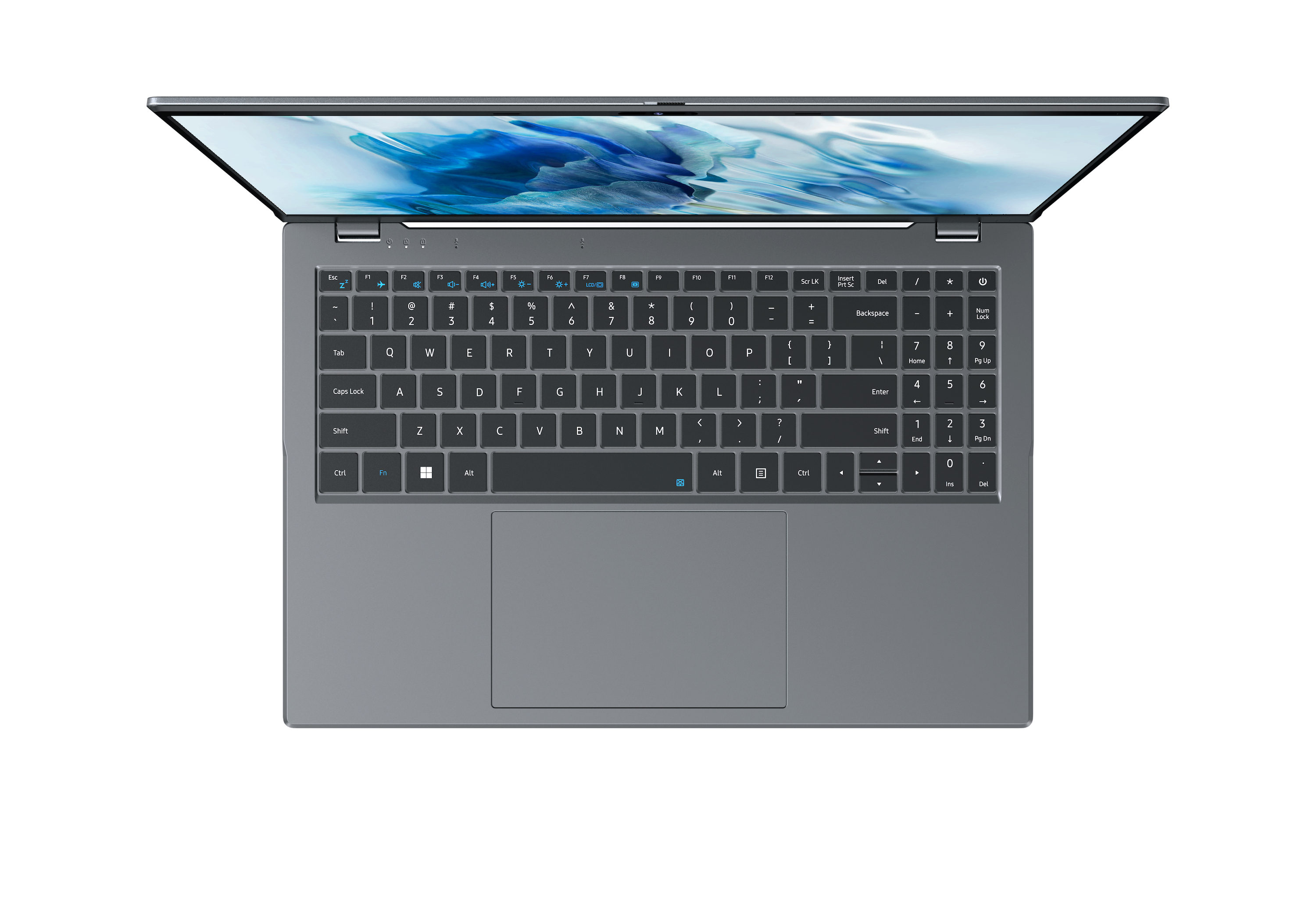 Un portátil gris, vista superior, abierto. El teclado es visible, con un panel táctil en la parte inferior.